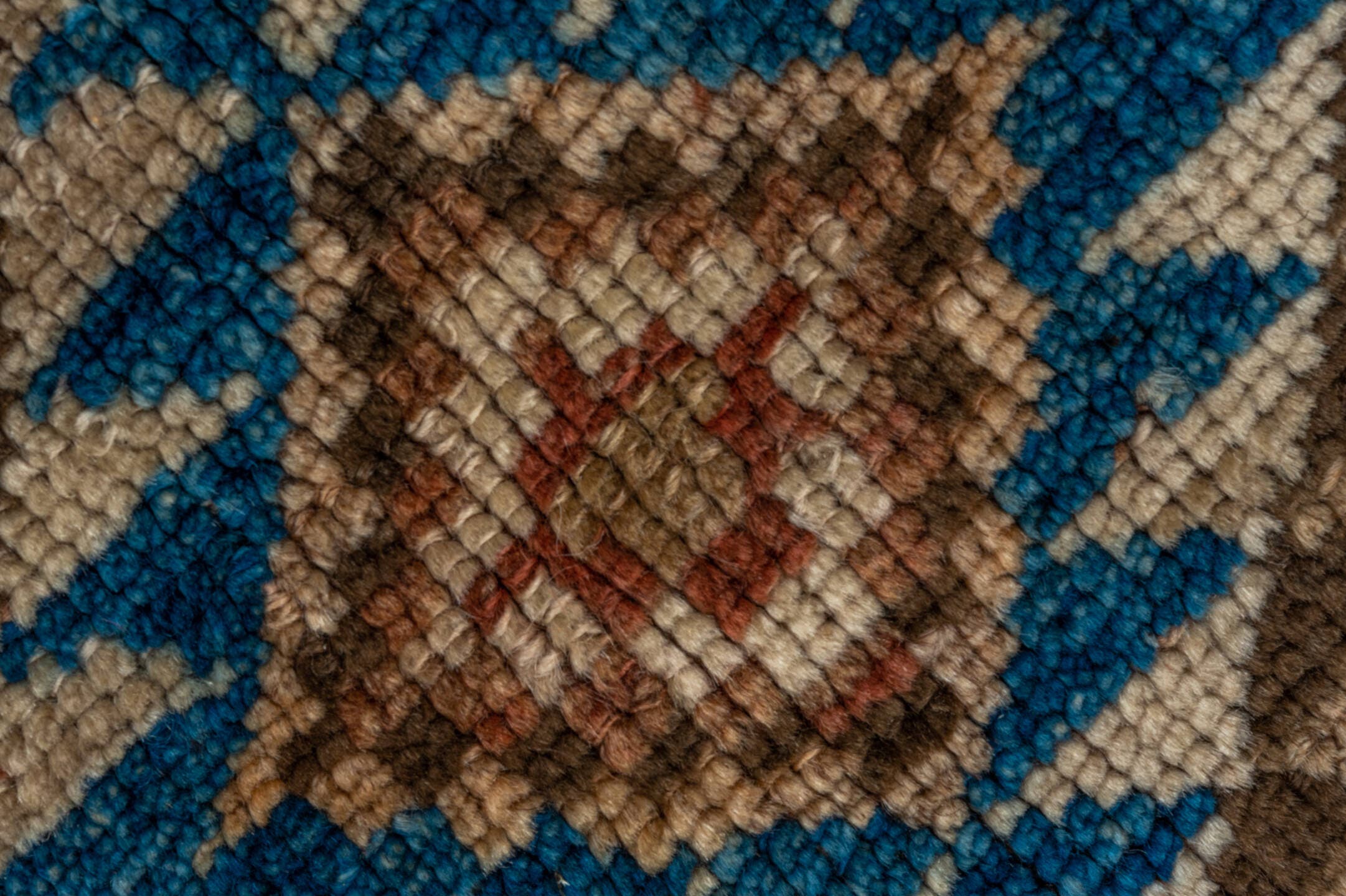 4' x 9' one-of-a-kind handmade vintage Kurd runner rug. Color palette: rust, ivory, brown, sky_blue, camel, taupe, charcoal