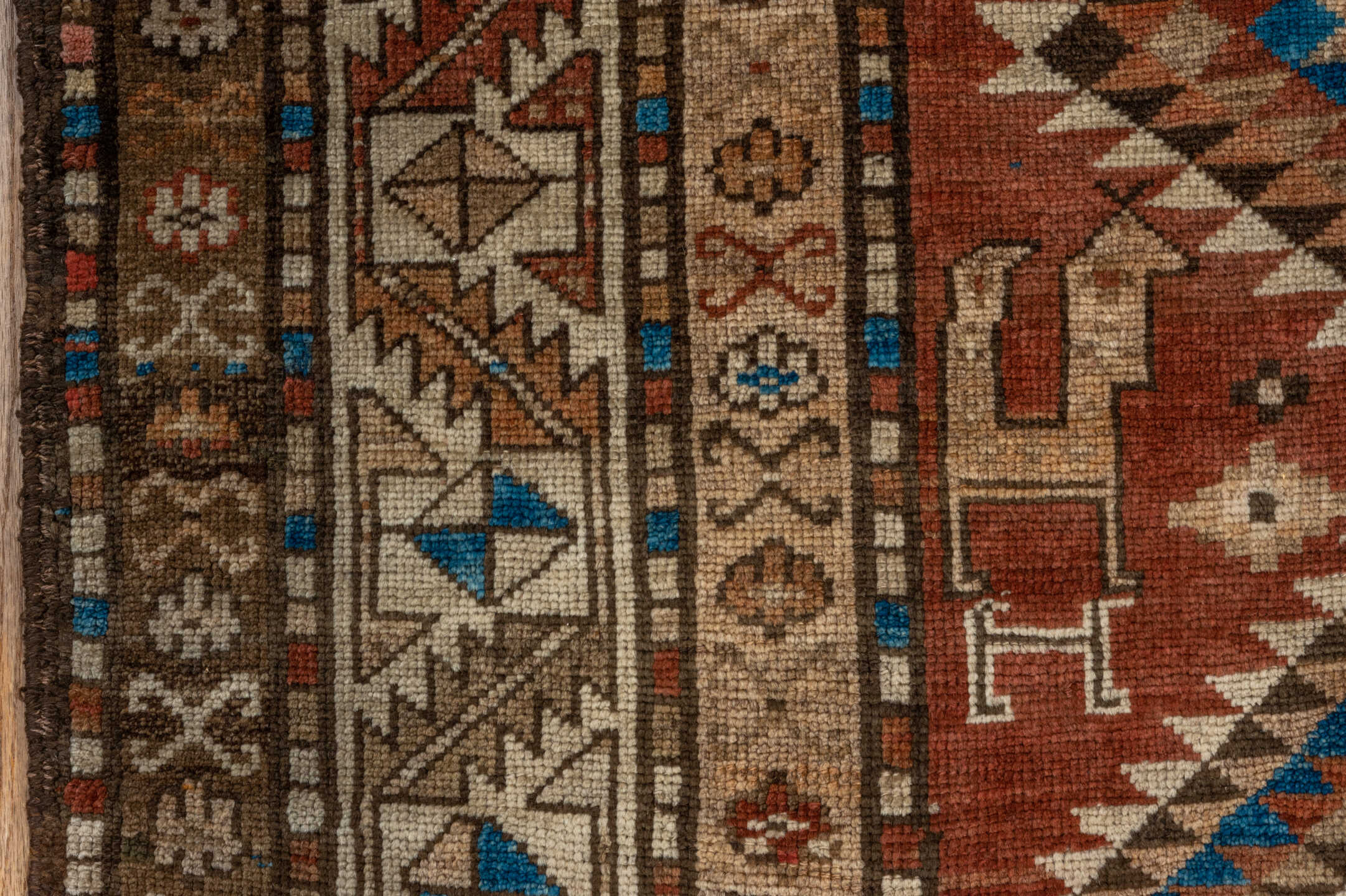 4' x 9' one-of-a-kind handmade vintage Kurd runner rug. Color palette: arapawa, blue, brown, gray, light gray, pink