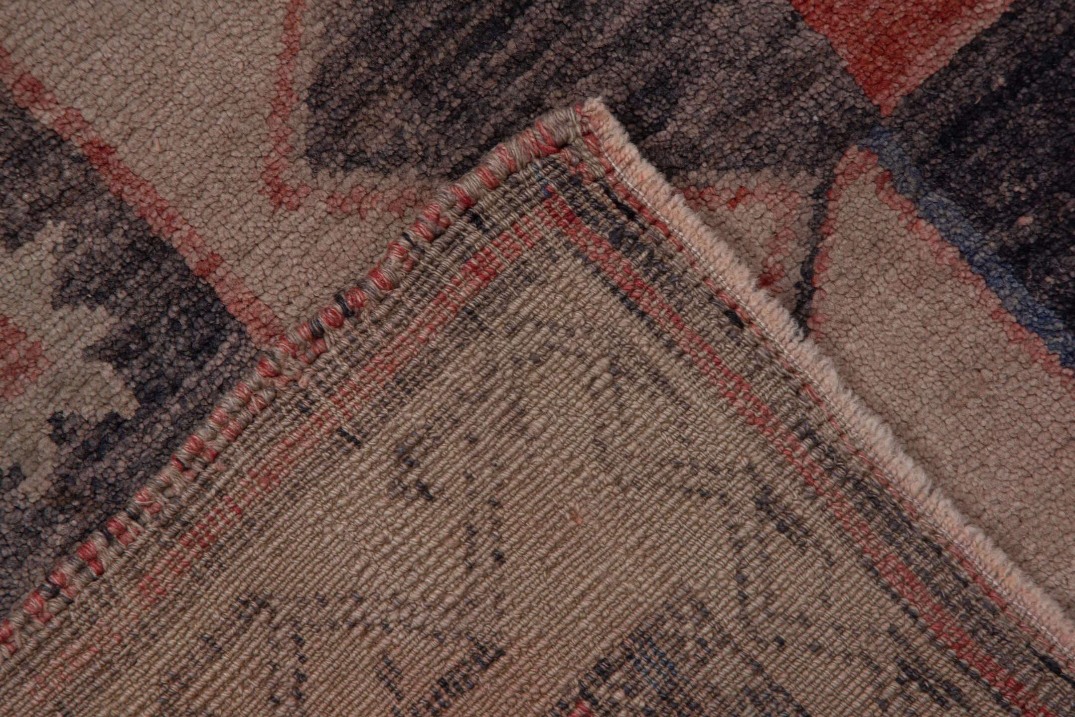 4' x 9' one-of-a-kind handmade vintage Oushak runner rug. Color palette: black, brown, charcoal, gray, pink, red, redwood