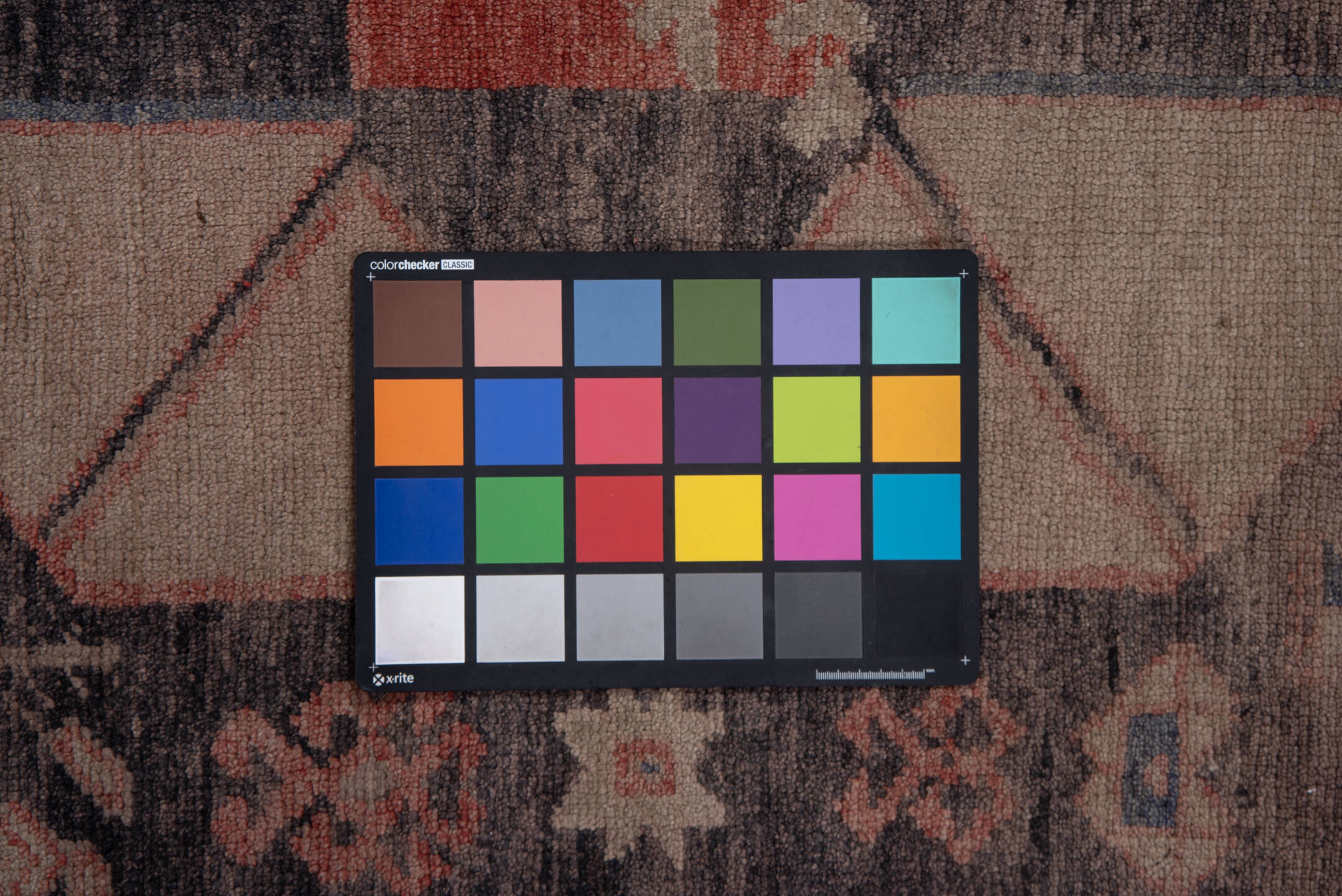 4' x 9' one-of-a-kind handmade vintage Oushak runner rug. Color palette: black, brown, charcoal, gray, pink, red, redwood