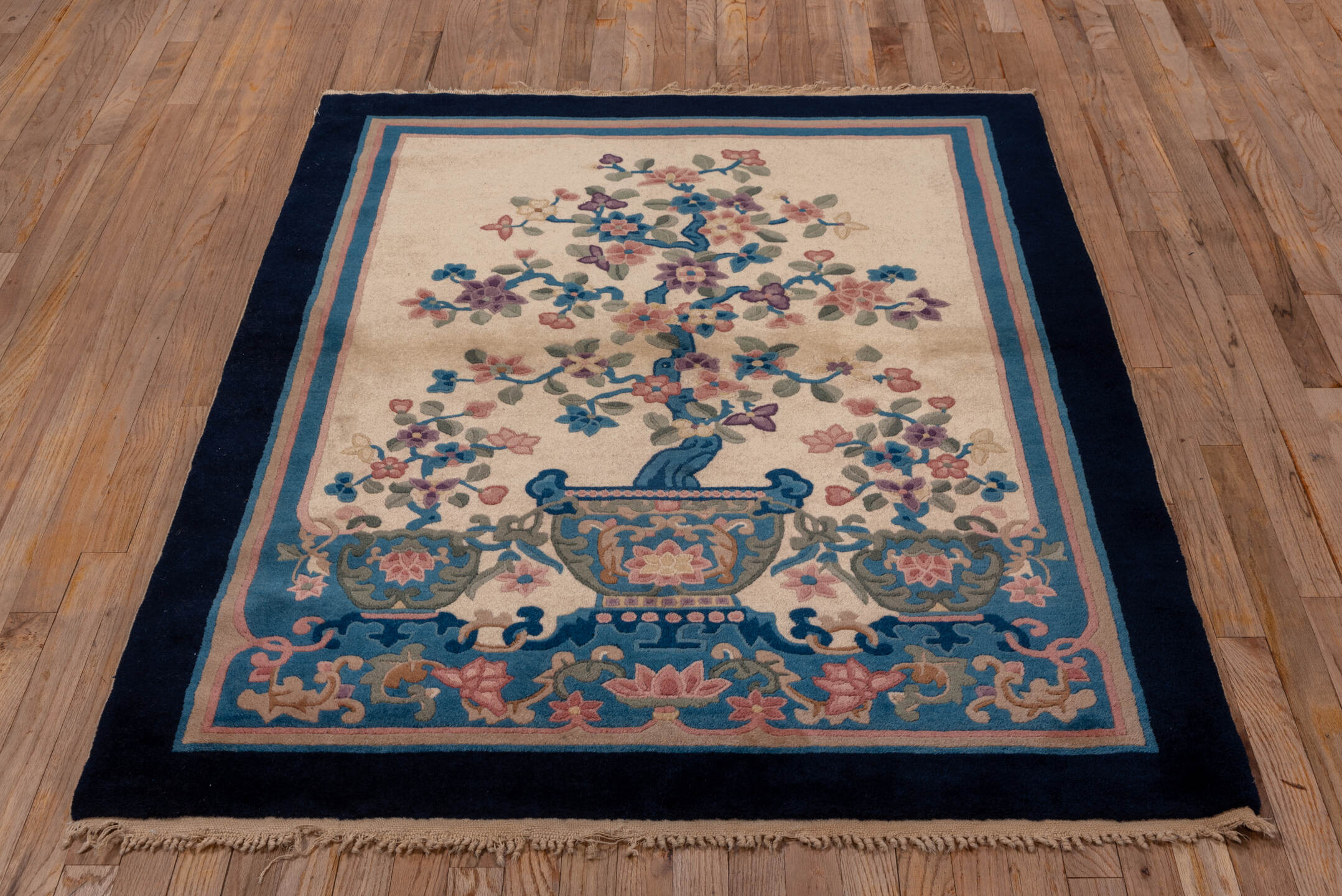 4' x 5' one-of-a-kind handmade vintage Chinese small size rug. Color palette: ivory, navy, blue, rose, sage, lavender, taupe