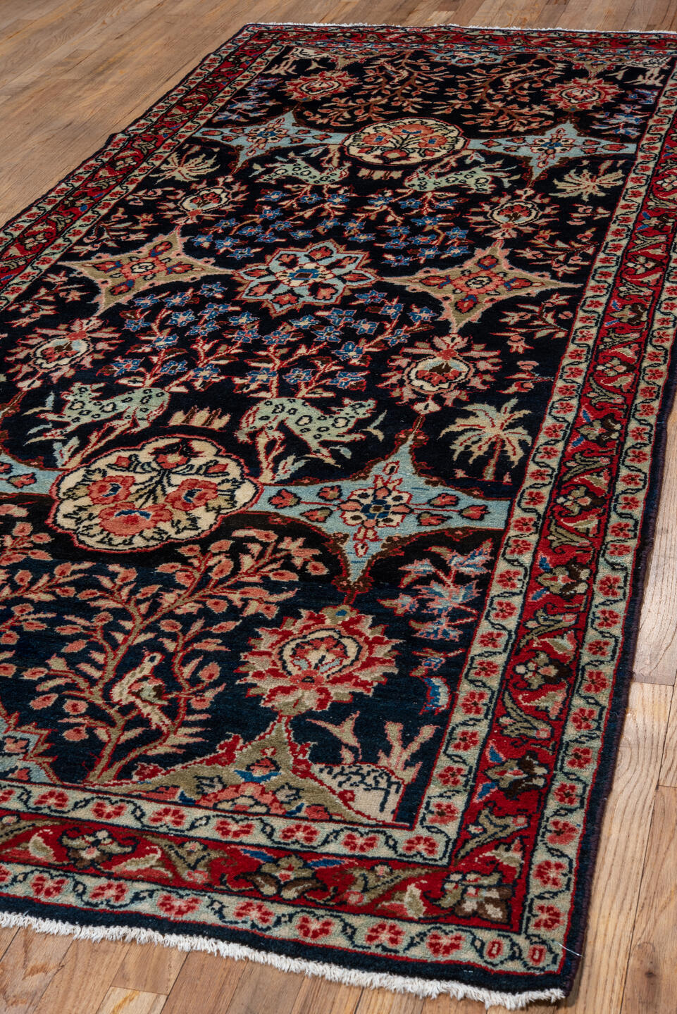 4' x 10' one-of-a-kind handmade vintage Mahal runner rug. Color palette: arapawa, black, blue, brown, gray, pink, red
