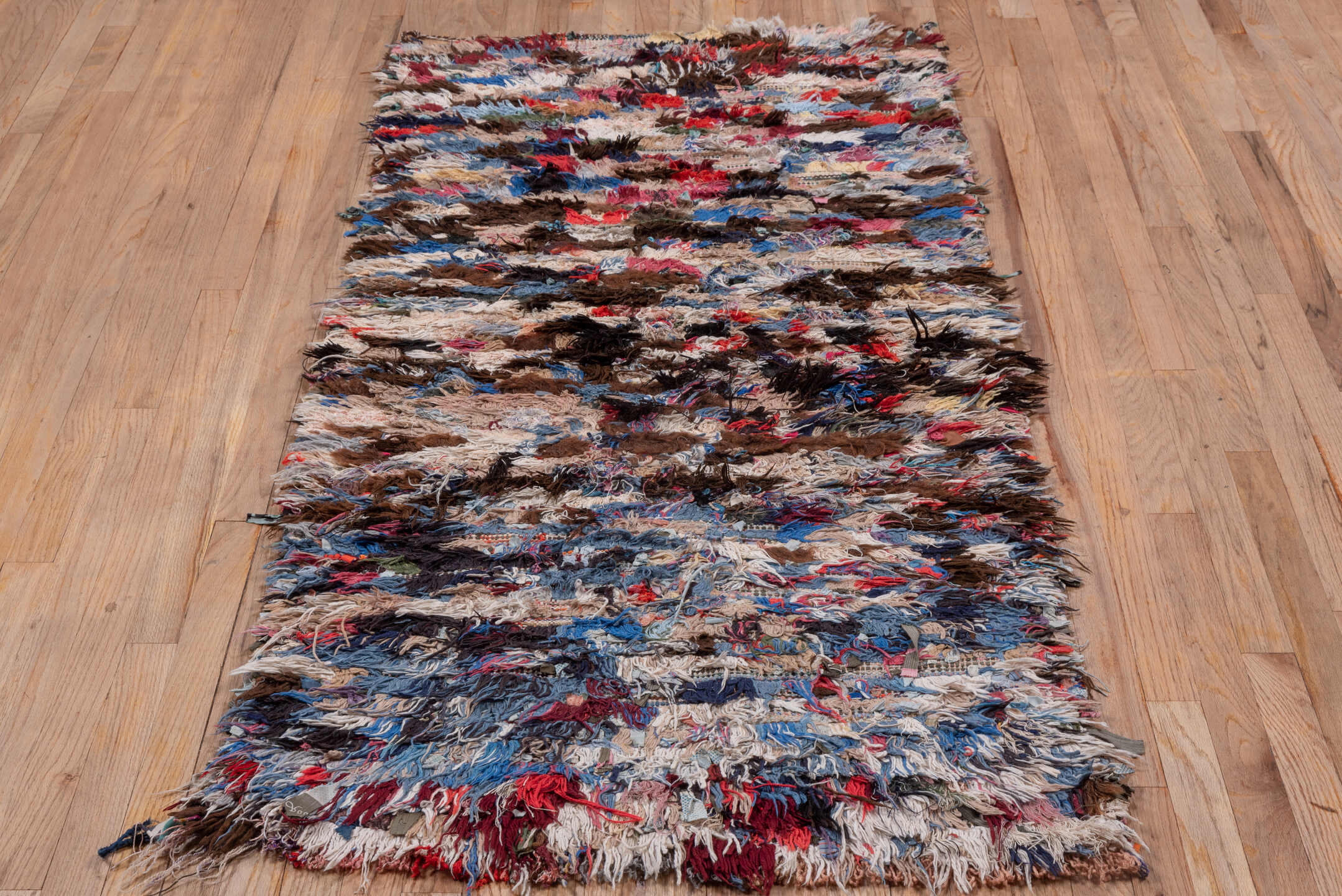 2' x 6' one-of-a-kind handmade vintage Rag Rug runner rug. Color palette: brown, ivory, blue, red, charcoal, cream, burgundy