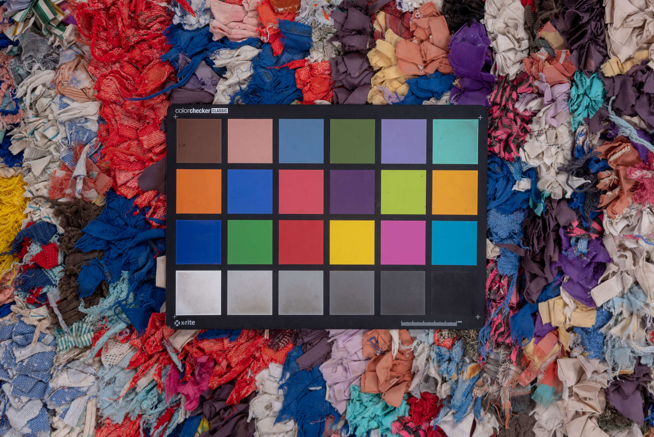4' x 7' one-of-a-kind handmade vintage Rag Rug rug. Color palette: ivory, gray, blue, pink, purple, red, yellow, charcoal