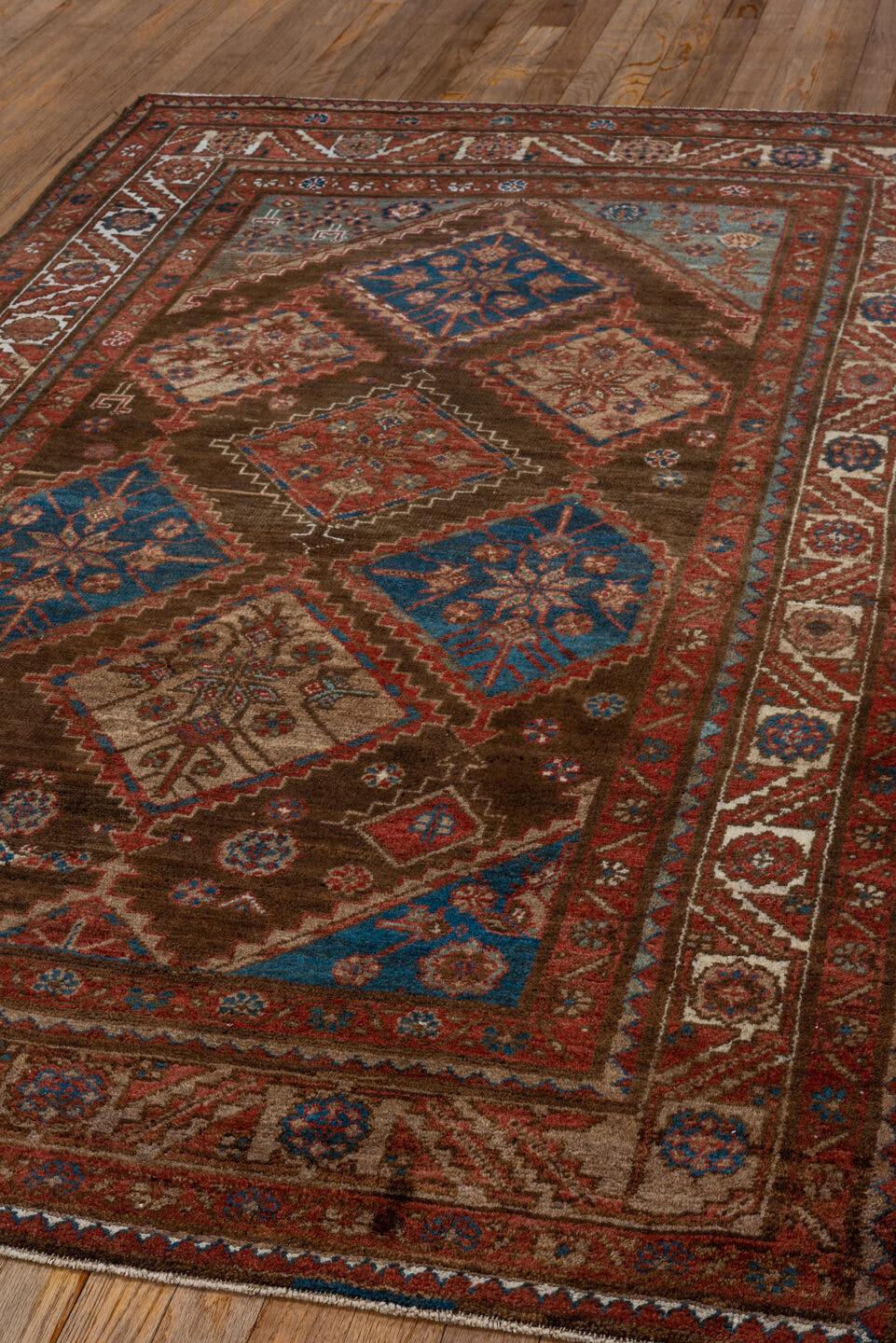 4' x 7' one-of-a-kind handmade vintage Malayer rug. Color palette: brown, rust, ivory, blue, red, camel, terracotta, beige