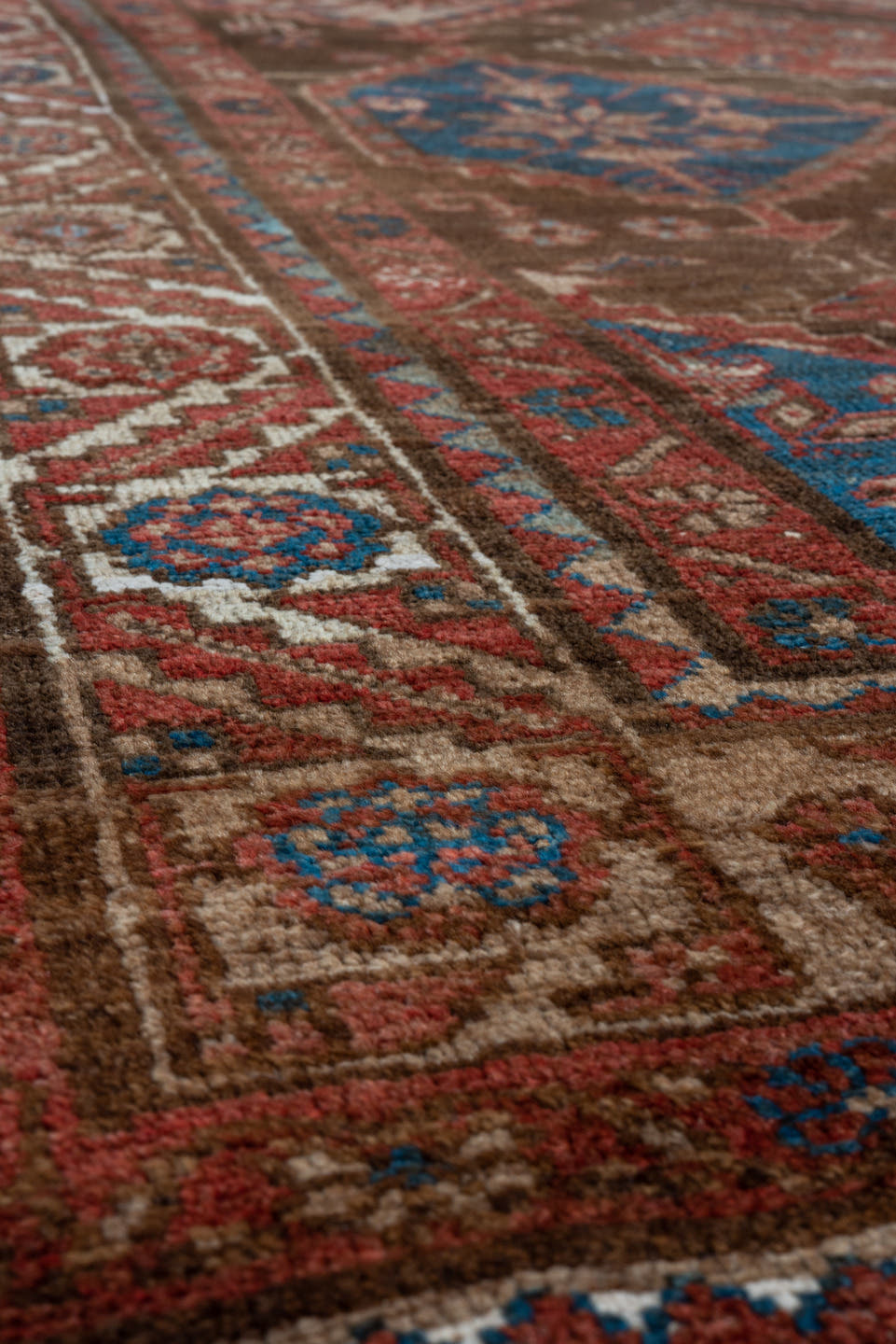 4' x 7' one-of-a-kind handmade vintage Malayer rug. Color palette: brown, rust, ivory, blue, red, camel, terracotta, beige