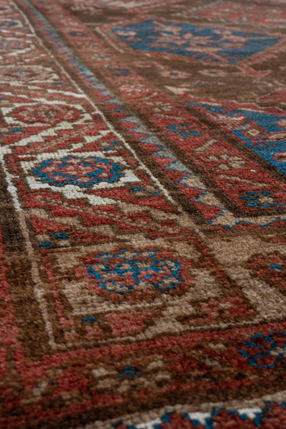 4' x 7' one-of-a-kind handmade vintage Malayer rug. Color palette: brown, rust, ivory, blue, red, camel, terracotta, beige
