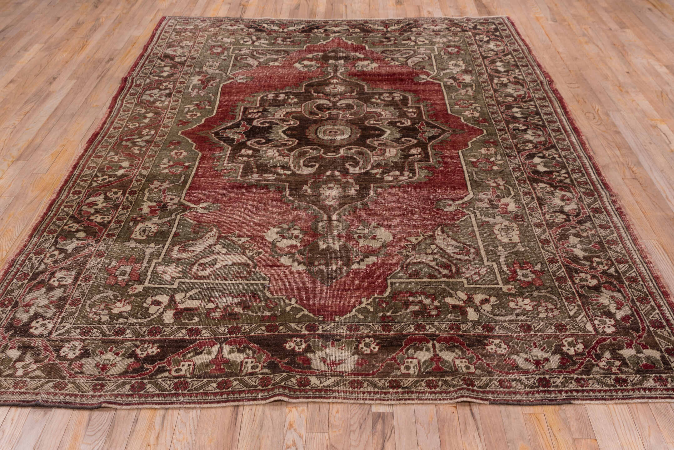 7' x 10' one-of-a-kind handmade vintage Oushak large size rug. Color palette: brown, pink, red, redwood