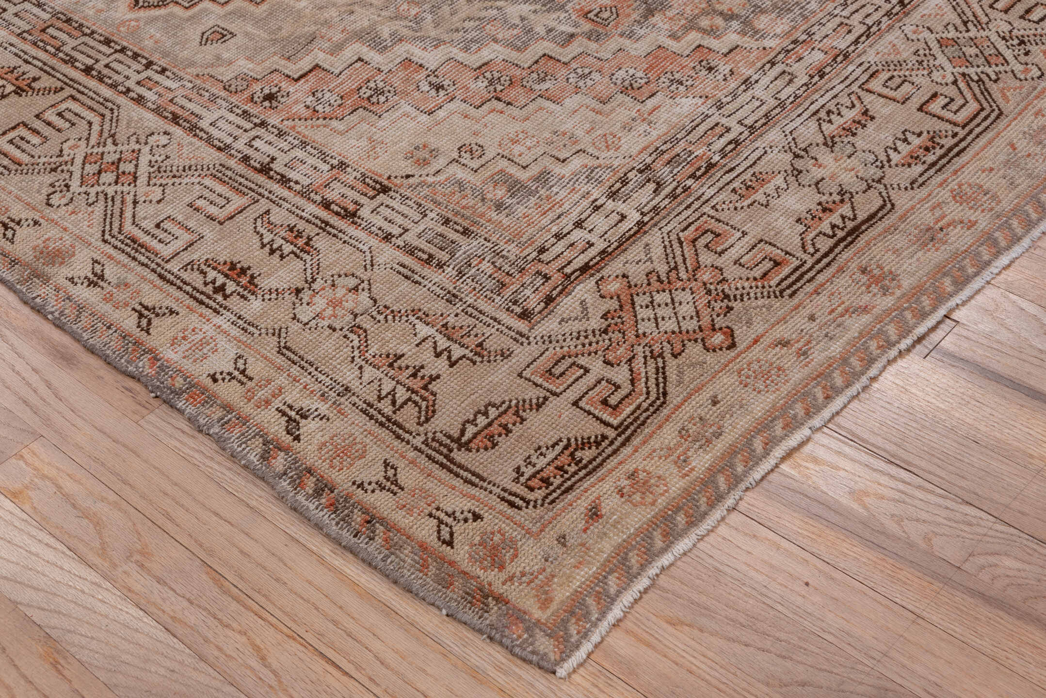 5' x 9' one-of-a-kind handmade vintage Khotan medium size rug. Color palette: brown, gray, light gray, off-white, pink