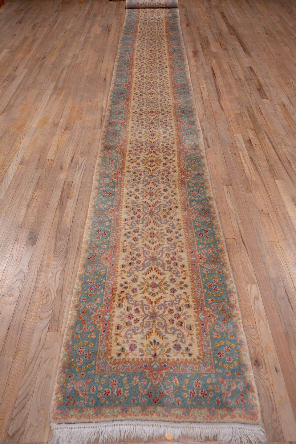 2' x 20' one-of-a-kind handmade vintage Kerman runner rug. Color palette: ivory, blue, rust, rose, gold, taupe, terracotta