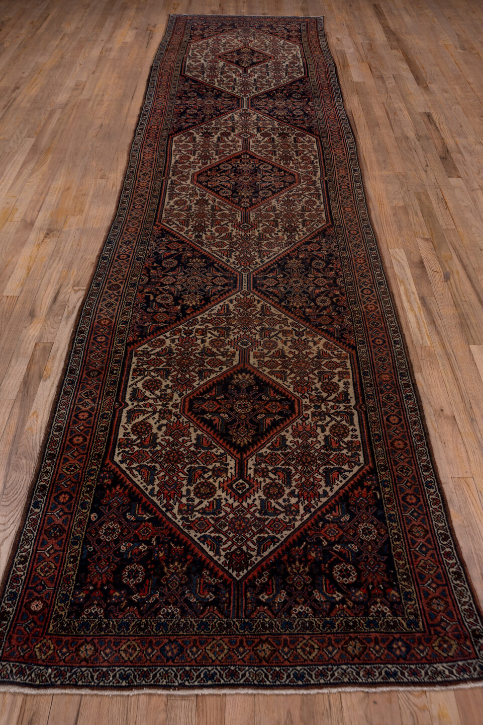 3' x 14' one-of-a-kind handmade antique Bibikabad runner rug. Color palette: ivory, navy, rust, terracotta, camel, burgundy