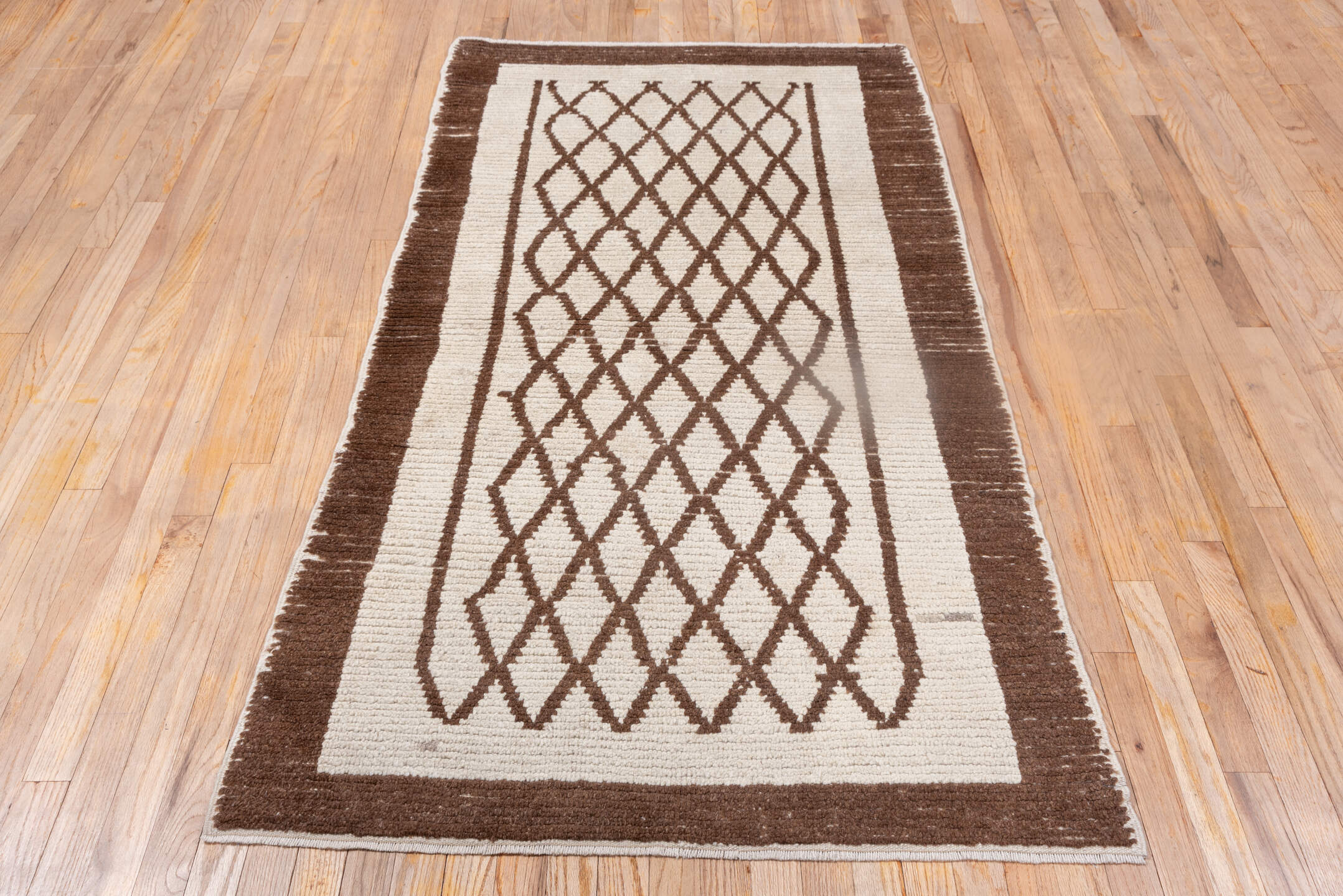 3' x 6' one-of-a-kind handmade vintage Tulu small size rug. Color palette: ivory, brown