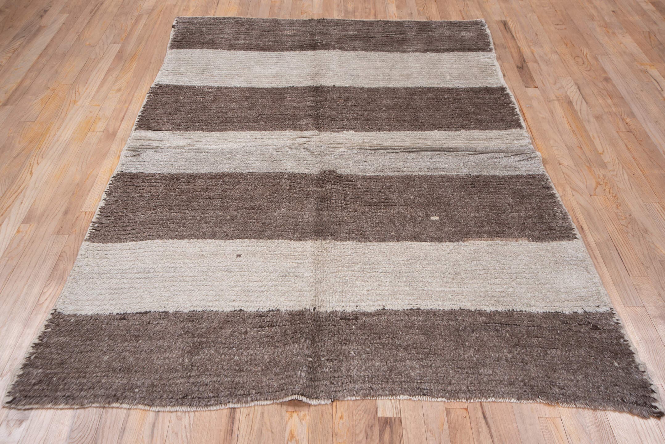 5' x 7' one-of-a-kind handmade antique Moroccan rug. Color palette: taupe, ivory, cream, greige, stone, beige, gray