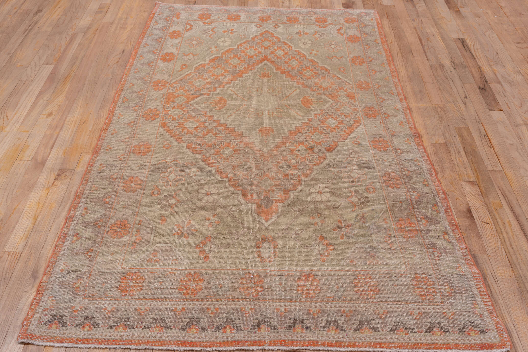 4' x 7' one-of-a-kind handmade antique Khotan rug. Color palette: taupe, coral, ivory, pewter, rose, camel, beige, gray