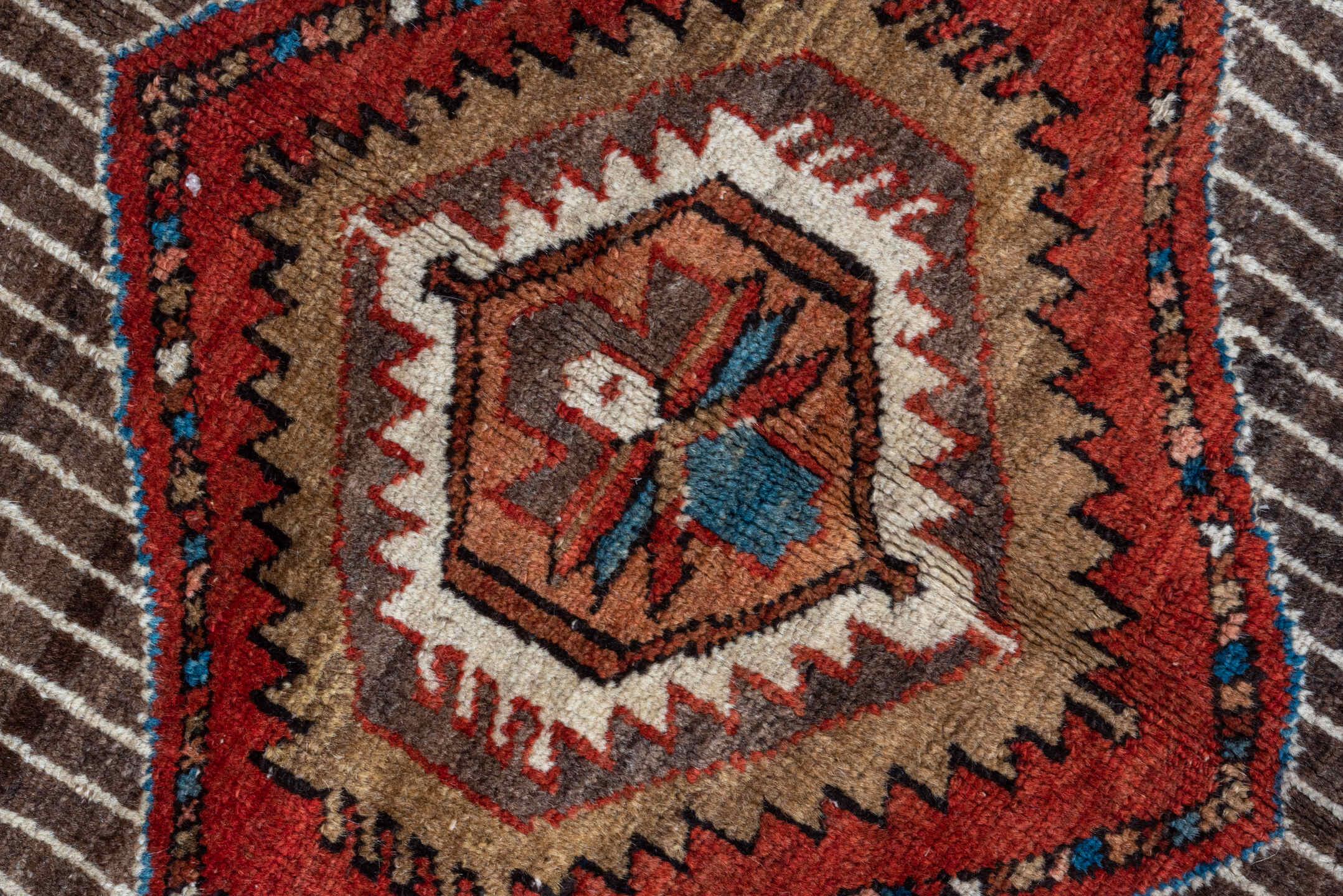 5' x 6' one-of-a-kind handmade antique Karaje rug. Color palette: rust, brown, ivory, indigo, navy, camel, crimson, taupe