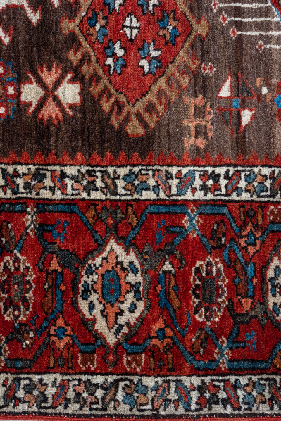 5' x 6' one-of-a-kind handmade antique Karaje rug. Color palette: rust, brown, ivory, indigo, navy, camel, crimson, taupe