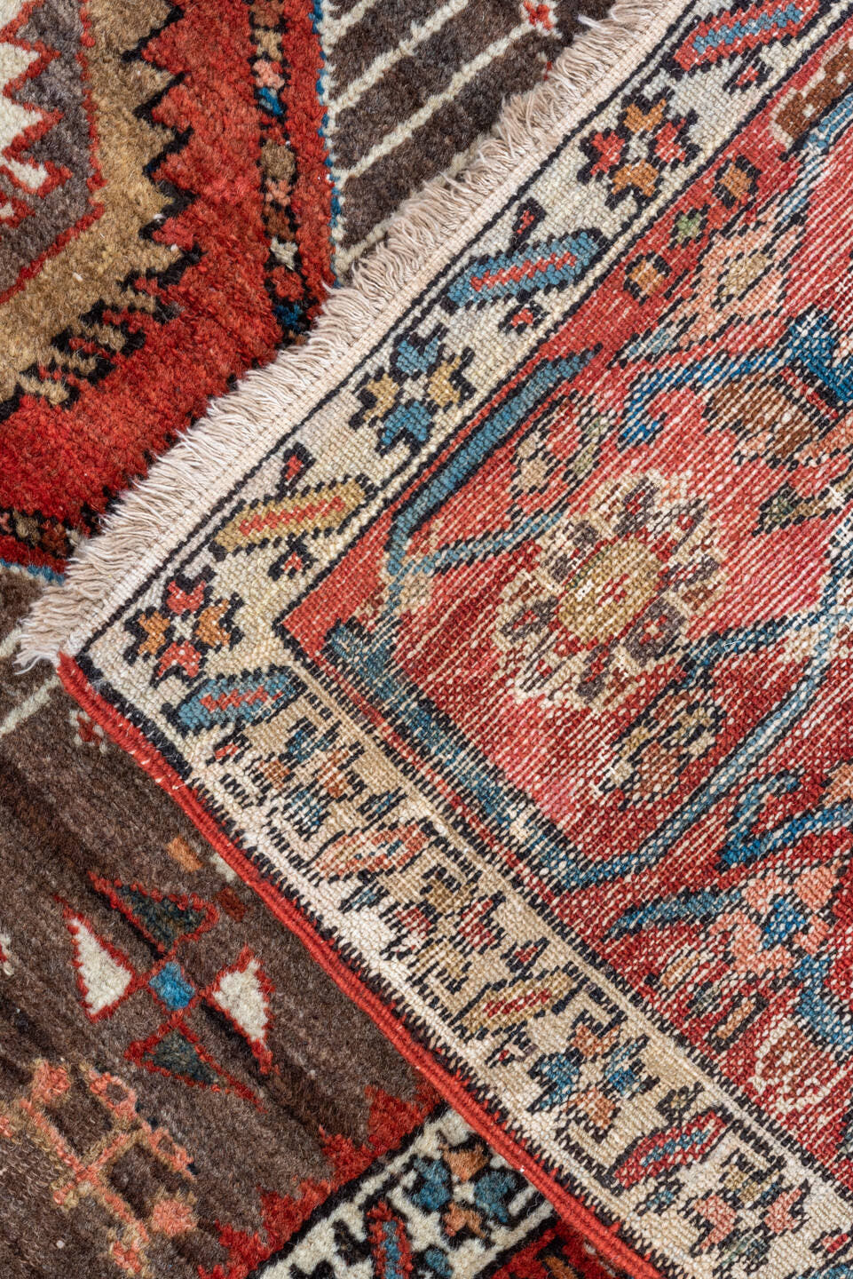 5' x 6' one-of-a-kind handmade antique Karaje rug. Color palette: rust, brown, ivory, indigo, navy, camel, crimson, taupe