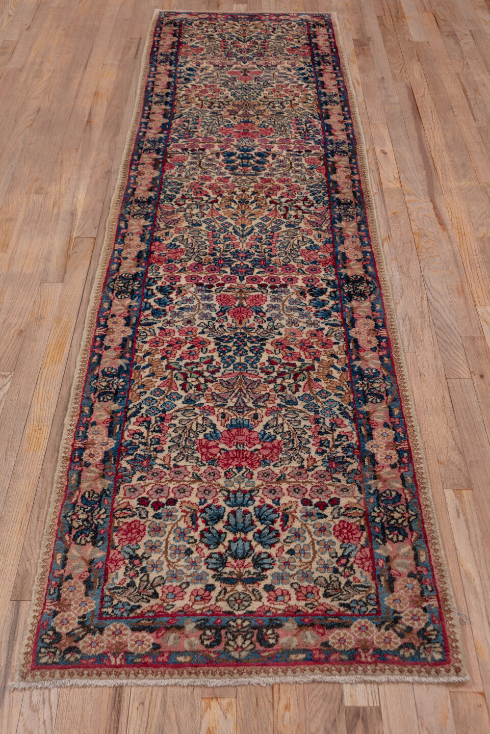 2' x 10' one-of-a-kind handmade vintage Kerman runner rug. Color palette: brown, dim gray, gray, pink, red