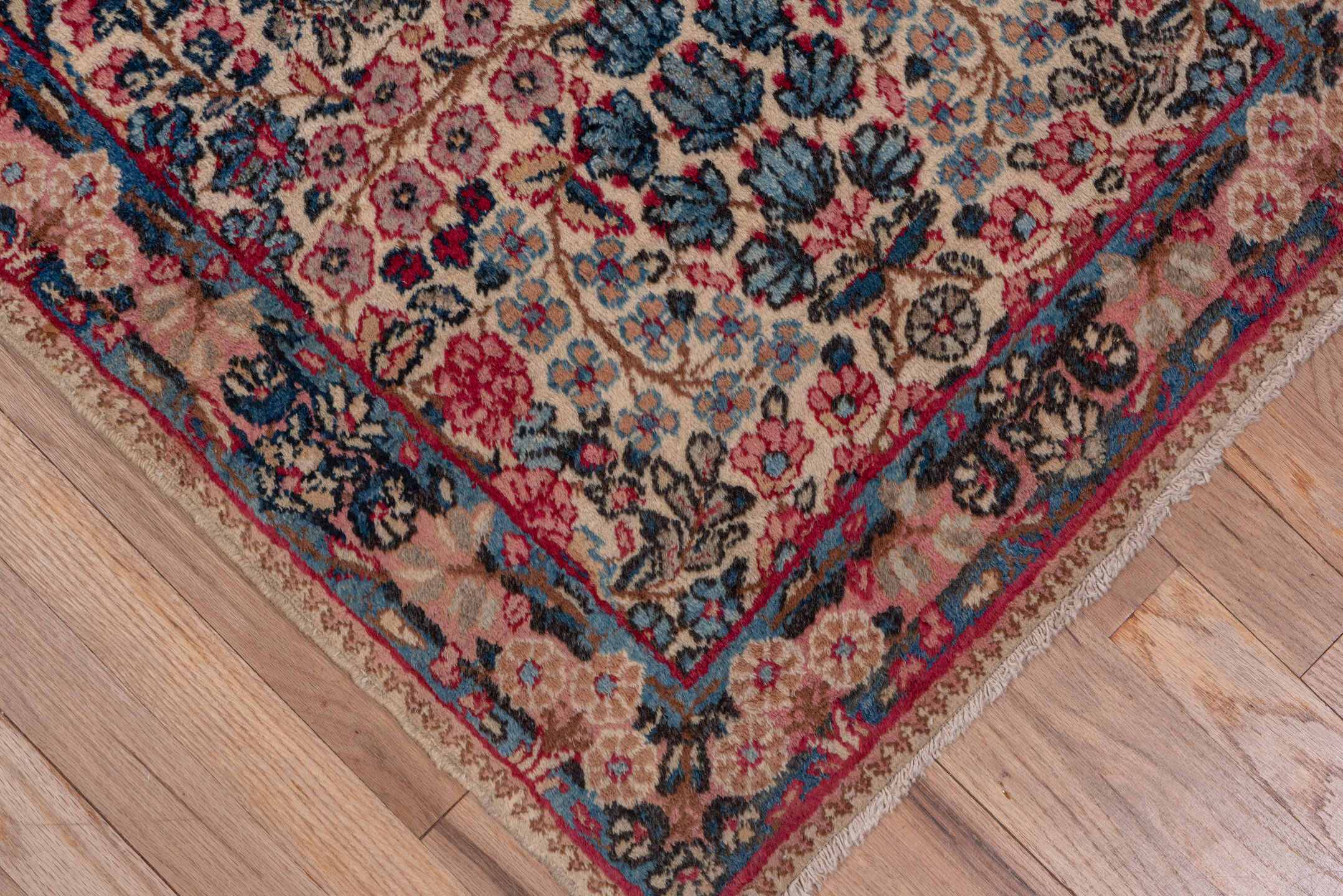 2' x 10' one-of-a-kind handmade antique Kerman runner rug. Color palette: ivory, navy, rose, dusty pink, rust, taupe