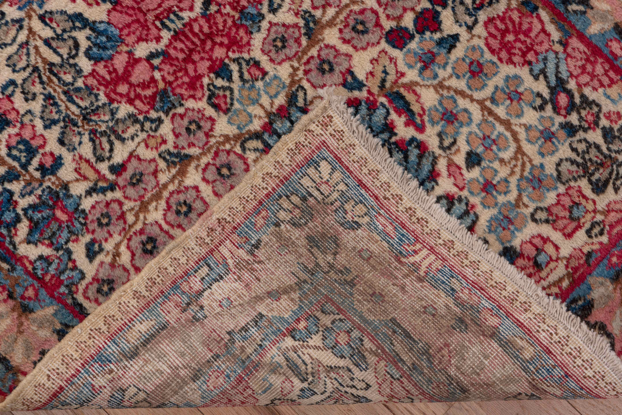 2' x 10' one-of-a-kind handmade antique Kerman runner rug. Color palette: ivory, navy, rose, dusty pink, rust, taupe