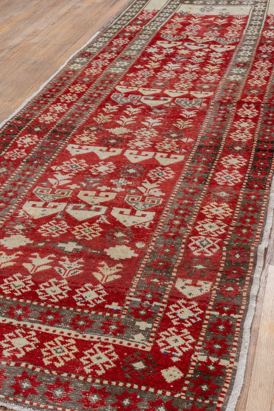 4' x 13' one-of-a-kind handmade antique Caucasian runner rug. Color palette: red, ivory, charcoal, taupe, sage, gray, black