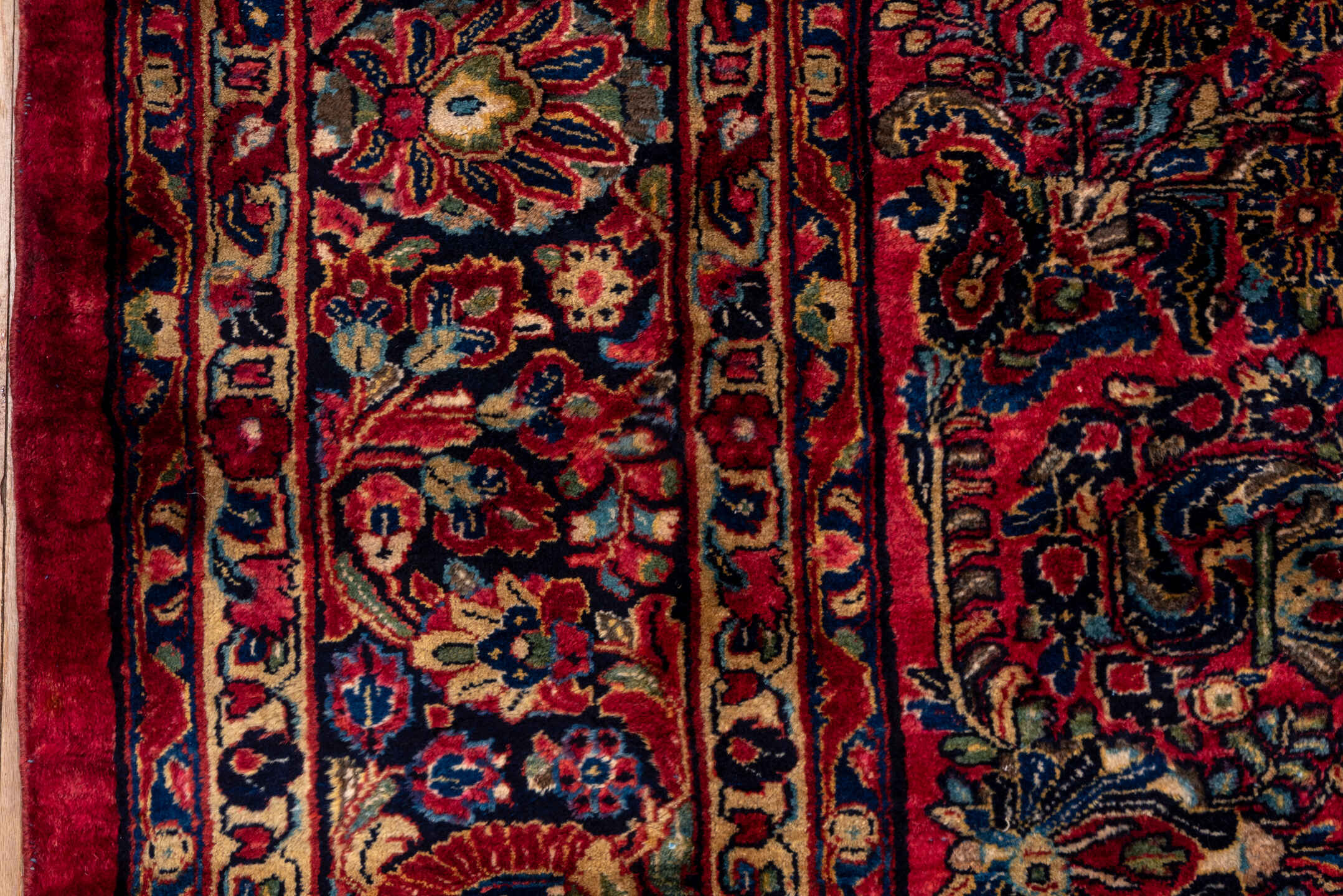 10' x 22' one-of-a-kind handmade vintage Sarouk rug. Color palette: black, blue, brown, burgundy, gray, pink, red