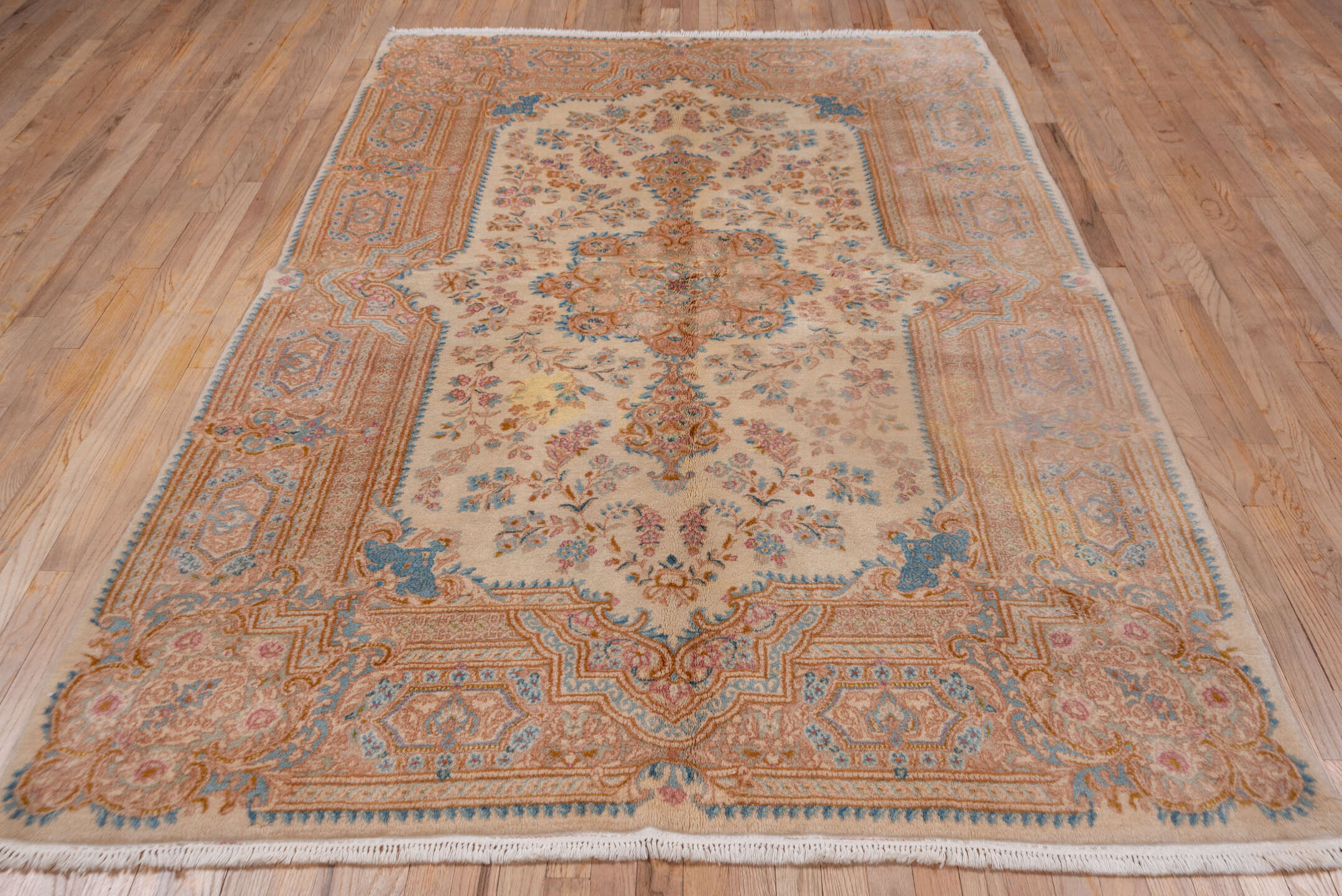 5' x 9' one-of-a-kind handmade vintage Kerman medium size rug. Color palette: ivory, beige, sky blue, blush, gold, taupe