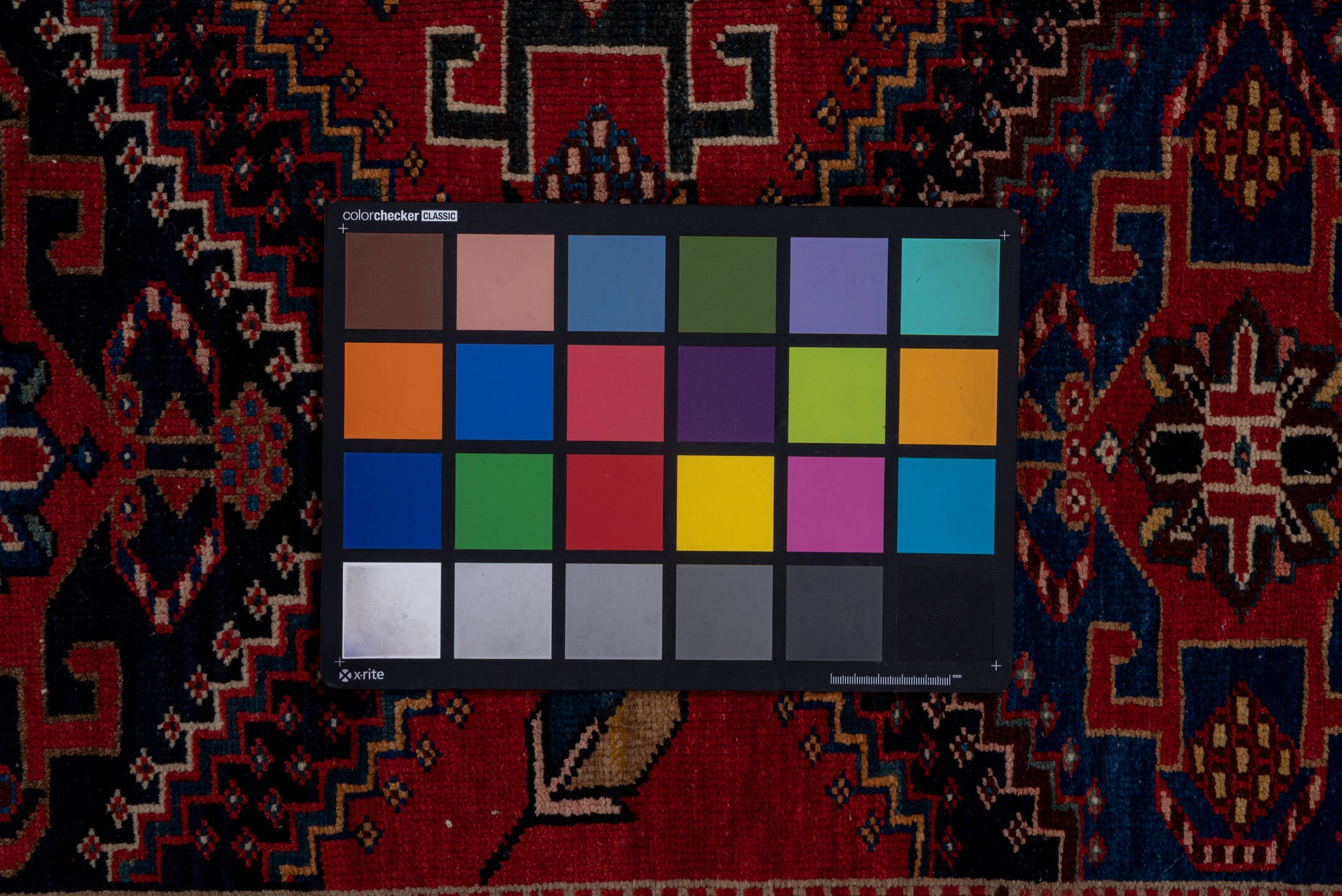 4' x 9' one-of-a-kind handmade vintage Baktiary runner rug. Color palette: black, blue, brown, fiord, gray, pink, red