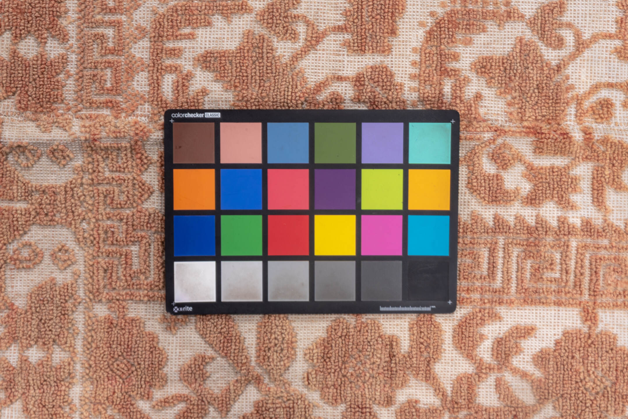 6' x 7' one-of-a-kind handmade vintage Spanish rug. Color palette: brown, gray, light gray, off-white, orange, pink