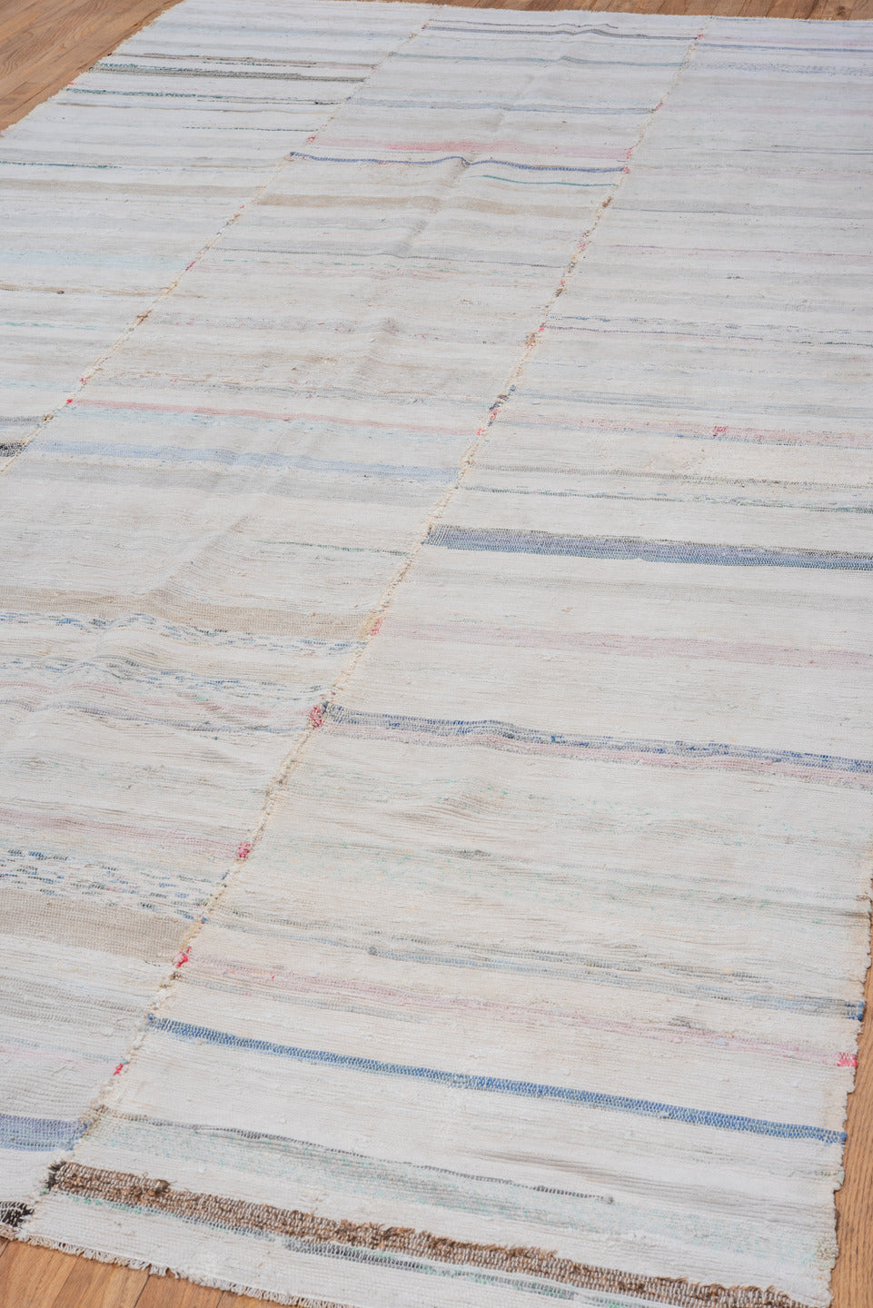 5' x 11' one-of-a-kind handmade antique Rag Rug rug. Color palette: ivory, pale blue, blush, taupe, charcoal, aqua