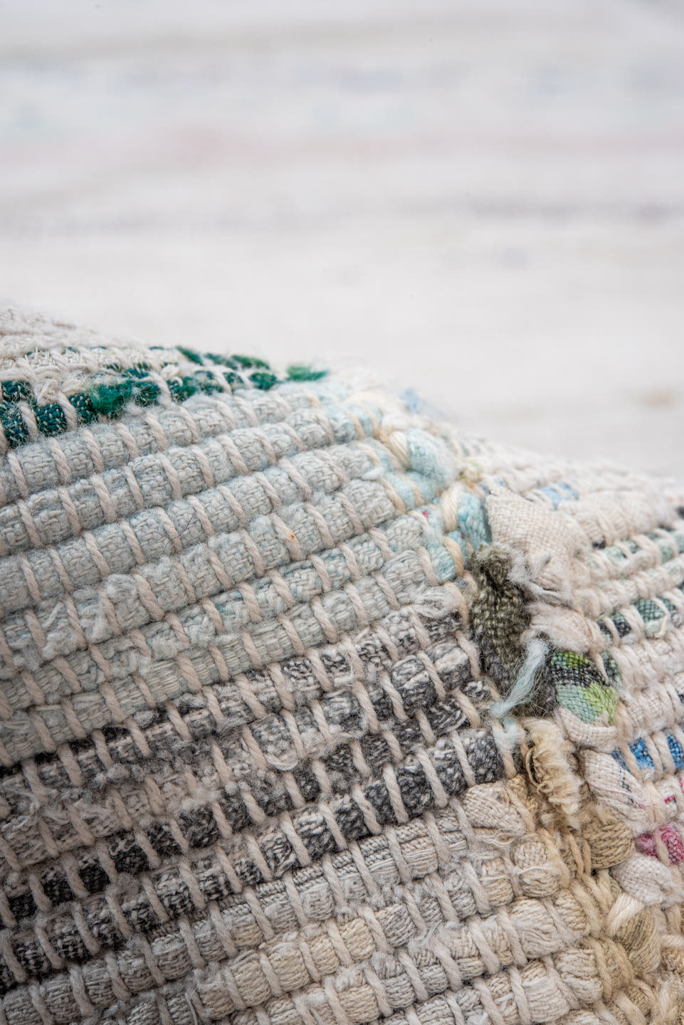 5' x 11' one-of-a-kind handmade antique Rag Rug rug. Color palette: ivory, pale blue, blush, taupe, charcoal, aqua