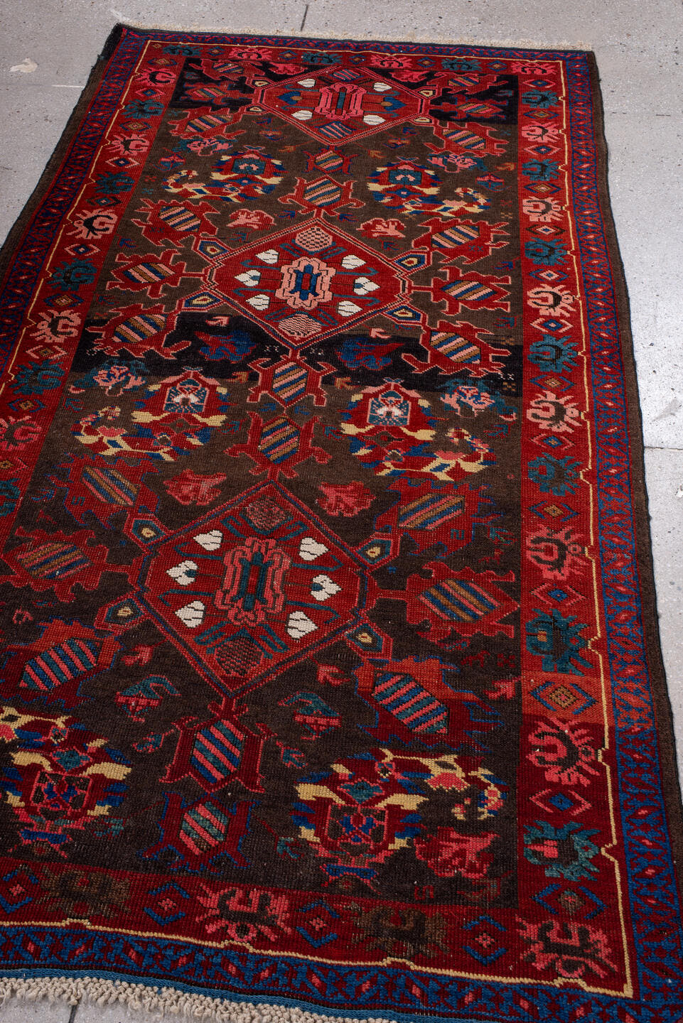3' x 6' one-of-a-kind handmade vintage Zeichur small size rug. Color palette: brown, red, blue, crimson, ivory, pink