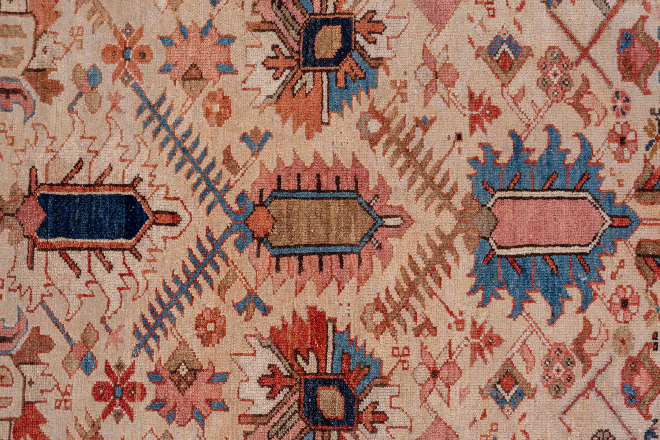12' x 18' one-of-a-kind handmade antique Serapi oversize rug. Color palette: ivory, rust, brick red, indigo, sky blue, camel