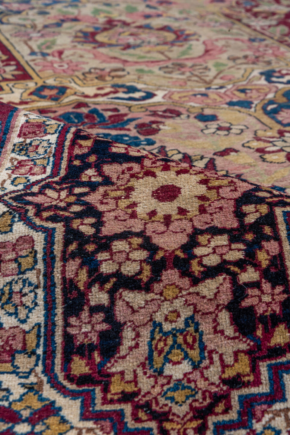 11' x 17' one-of-a-kind handmade antique Lavar oversize rug. Color palette: camel, burgundy, navy, ivory, rose, gold, sage