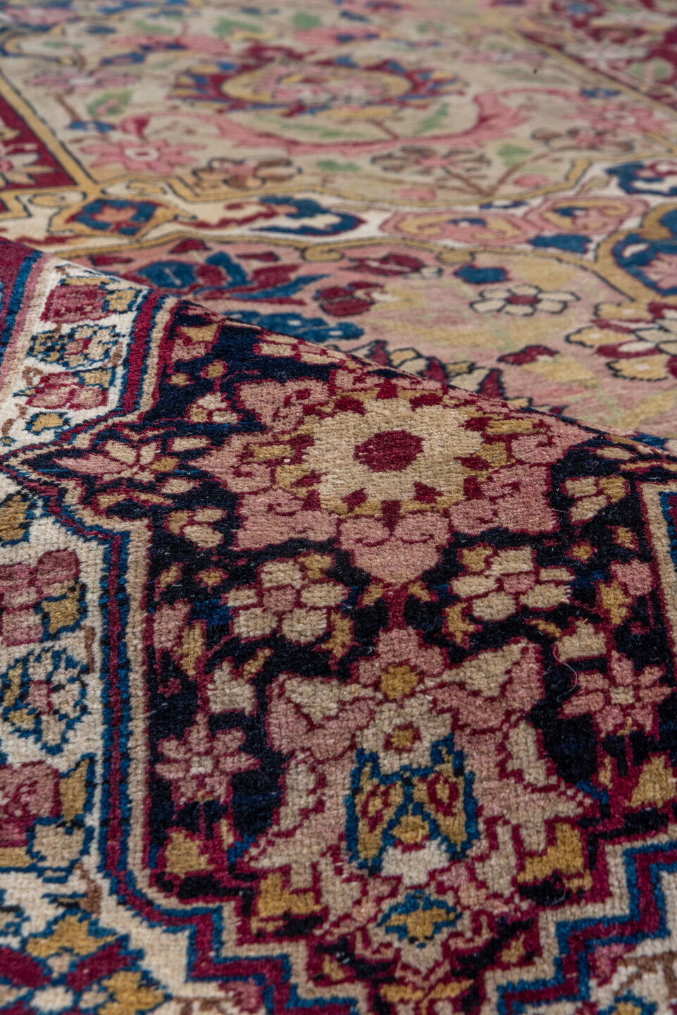 11' x 17' one-of-a-kind handmade antique Lavar oversize rug. Color palette: camel, burgundy, navy, ivory, rose, gold, sage