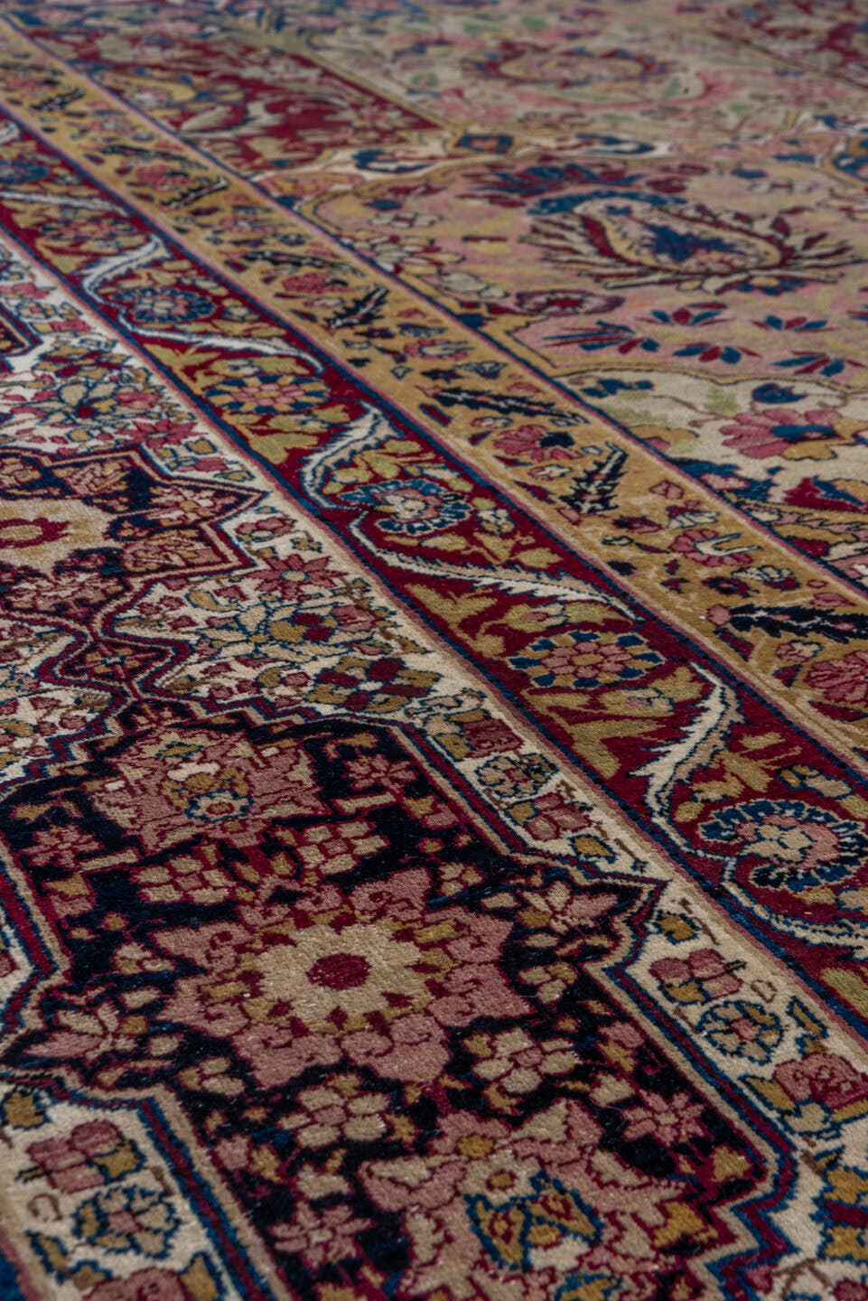 11' x 17' one-of-a-kind handmade antique Lavar oversize rug. Color palette: camel, burgundy, navy, ivory, rose, gold, sage