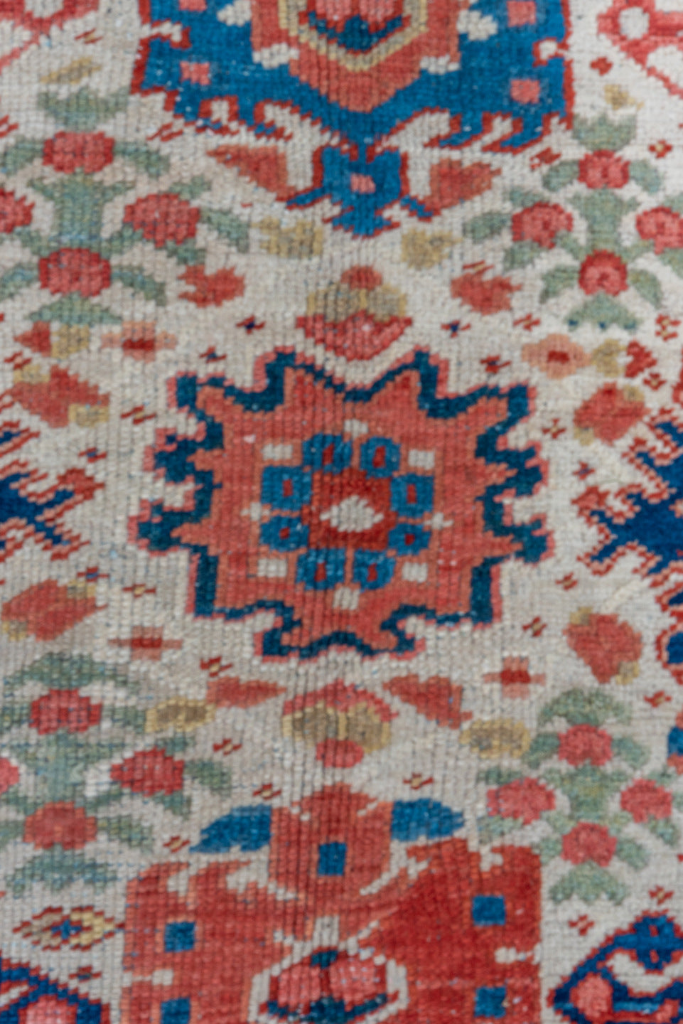 7' x 10' one-of-a-kind handmade antique Heriz large size rug. Color palette: ivory, navy, sky blue, rust, blush, crimson