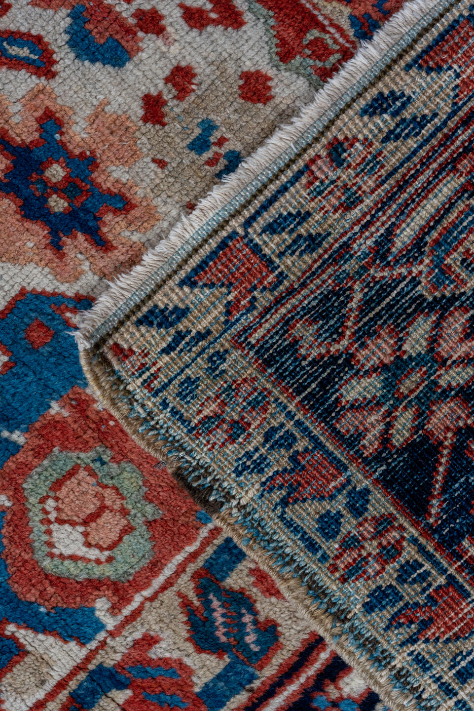 7' x 10' one-of-a-kind handmade antique Heriz large size rug. Color palette: ivory, navy, sky blue, rust, blush, crimson