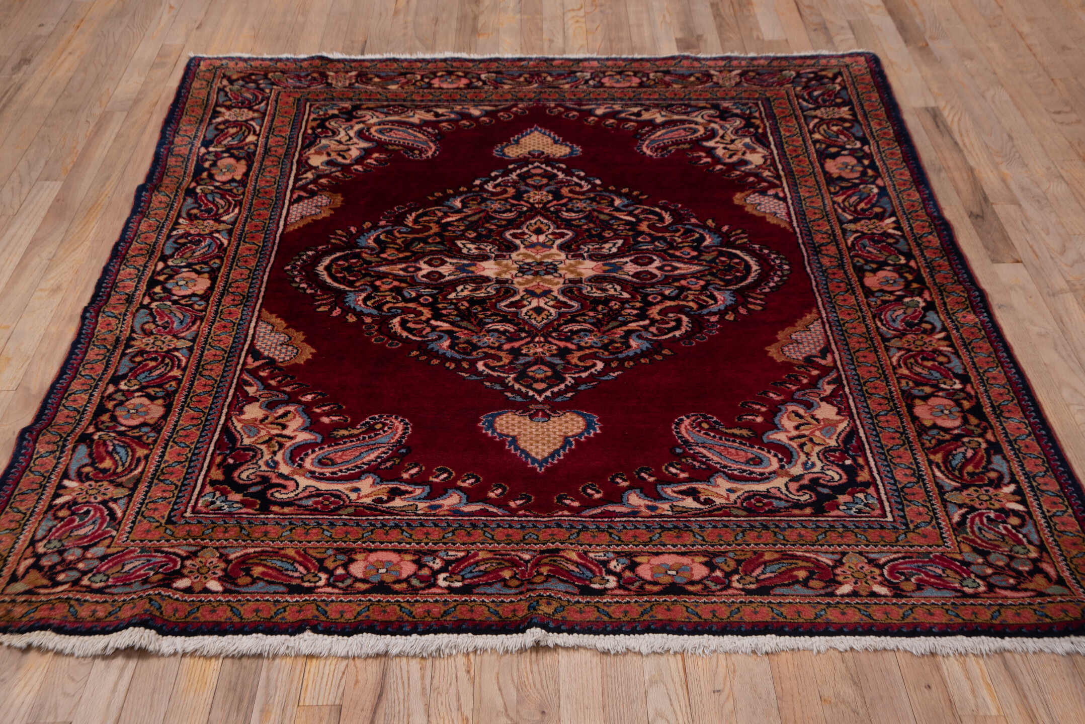 5' x 6' one-of-a-kind handmade vintage Lilian rug. Color palette: crimson, navy, ivory, rose, camel, sky_blue, burgundy, red