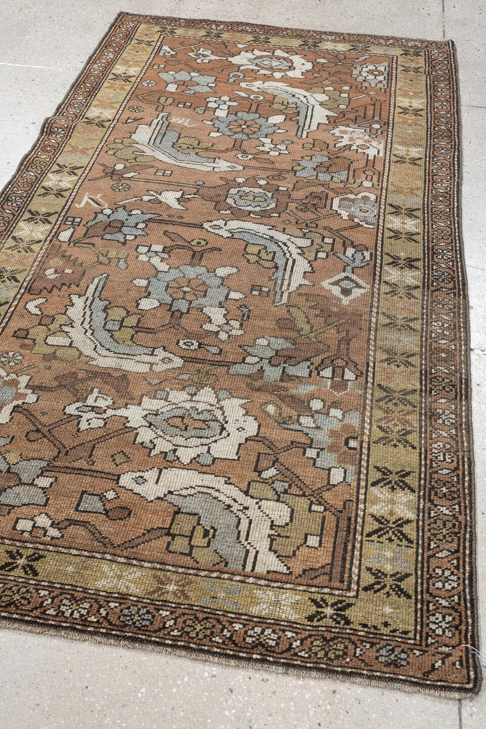 3' x 6' one-of-a-kind handmade antique Kurd rug. Color palette: terra cotta, ivory, sage, slate, camel, charcoal, taupe