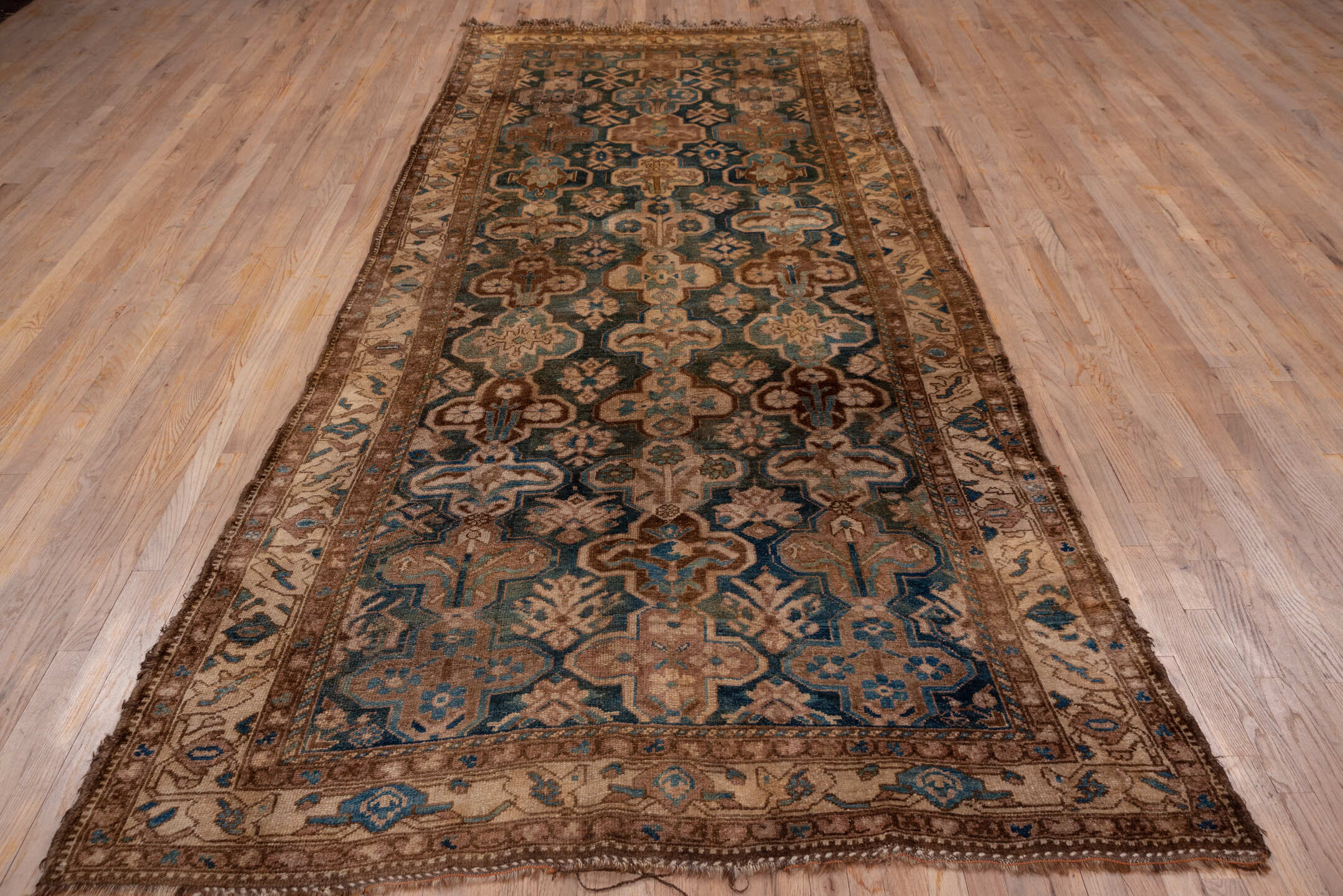 5' x 12' one-of-a-kind handmade antique Baktiary rug. Color palette: camel, taupe, teal, ivory, brown, slate, sky_blue