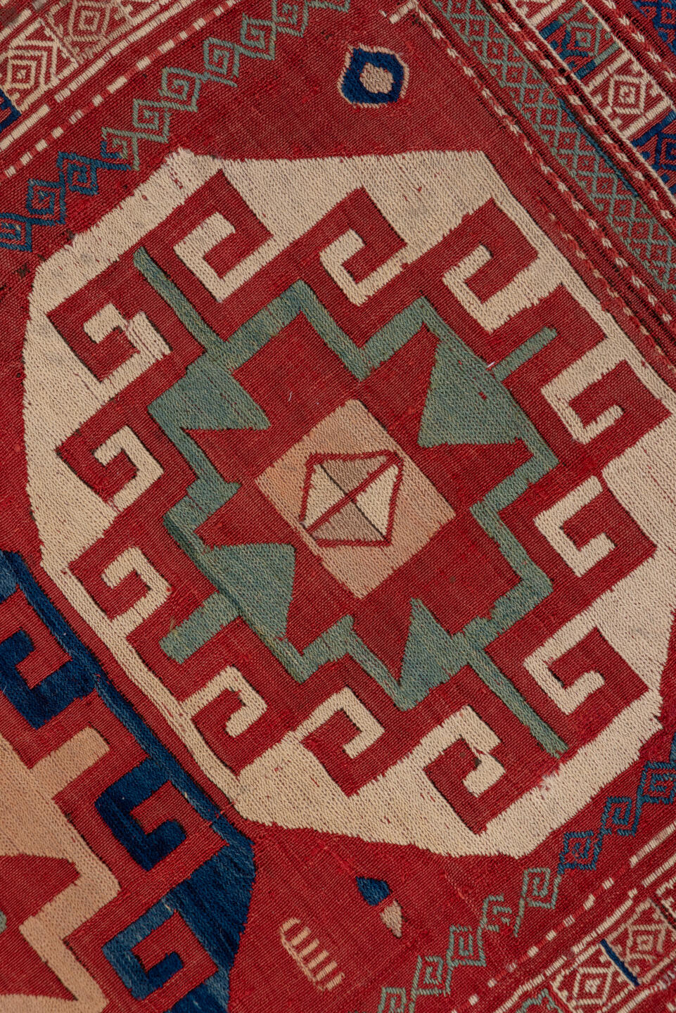 5' x 8' one-of-a-kind handmade vintage Sumak medium size rug. Color palette: blue, brown, fiord, gray, pink, red