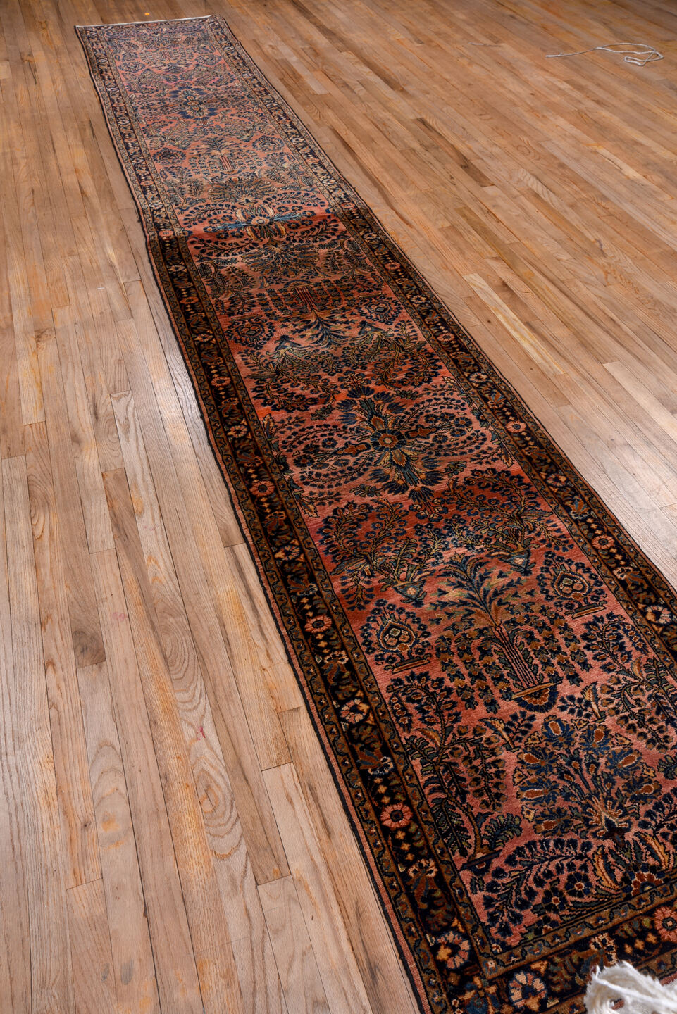 2' x 16' one-of-a-kind handmade vintage Lilian runner rug. Color palette: brown, gray, off-white, pink, red, redwood, snow