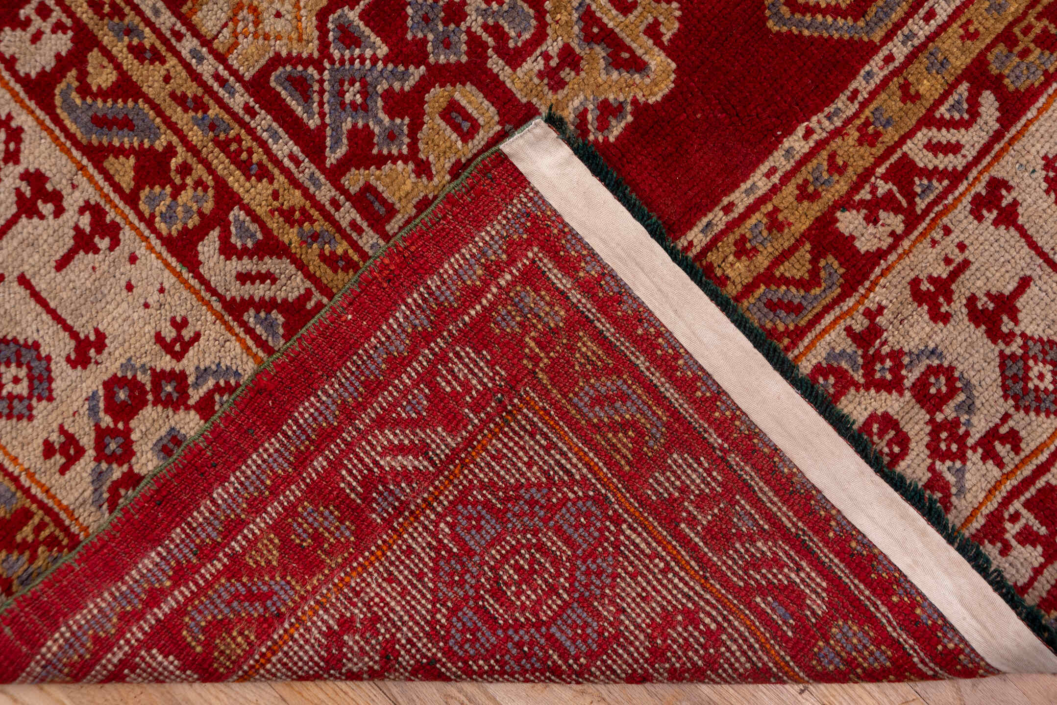 10' x 15' one-of-a-kind handmade antique Oushak rug. Color palette: rust, ivory, gold, blue, crimson, camel, terracotta