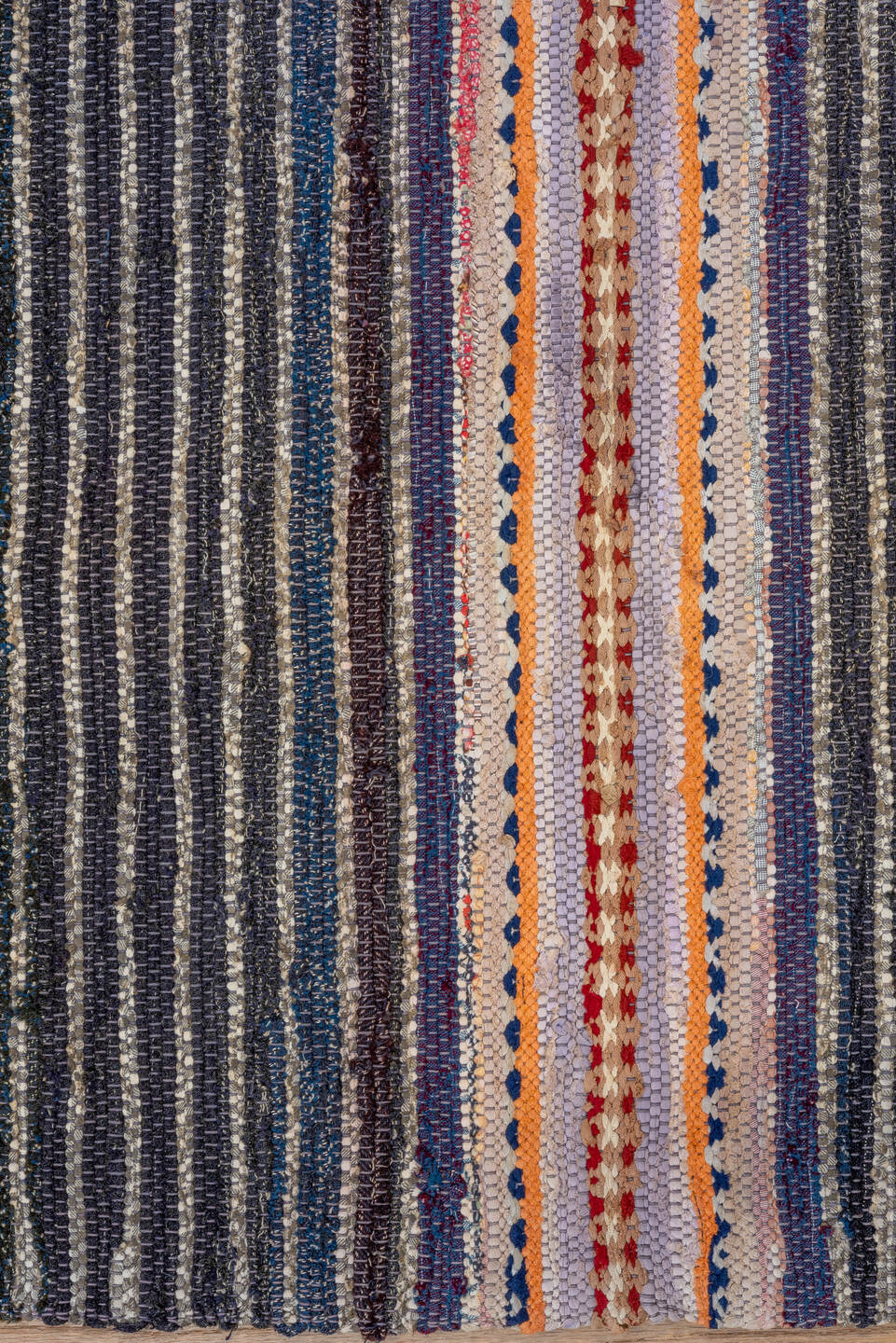 4' x 7' one-of-a-kind handmade vintage Rag Rug rug. Color palette: black, blue, brown, gray, light gray, off-white, orange