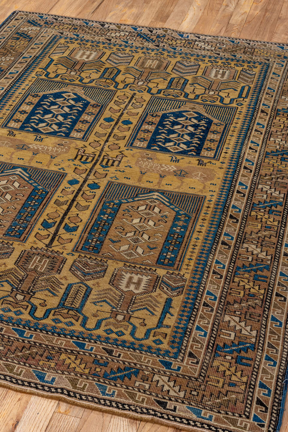 4' x 5' one-of-a-kind handmade antique Cabistan small size rug. Color palette: camel, brown, navy, ivory, taupe, charcoal