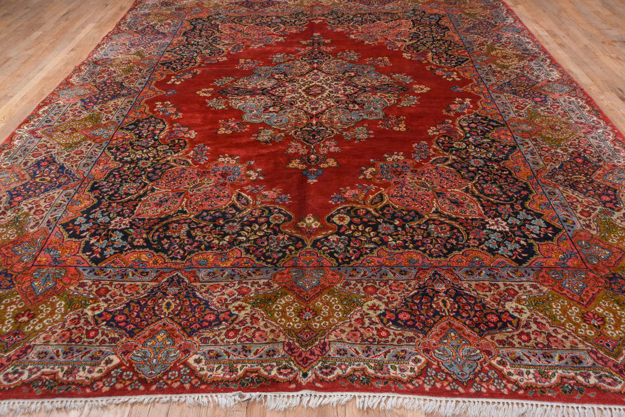 10' x 13' one-of-a-kind handmade antique Sarouk large size rug. Color palette: red, navy, ivory, sky blue, rose, gold, camel