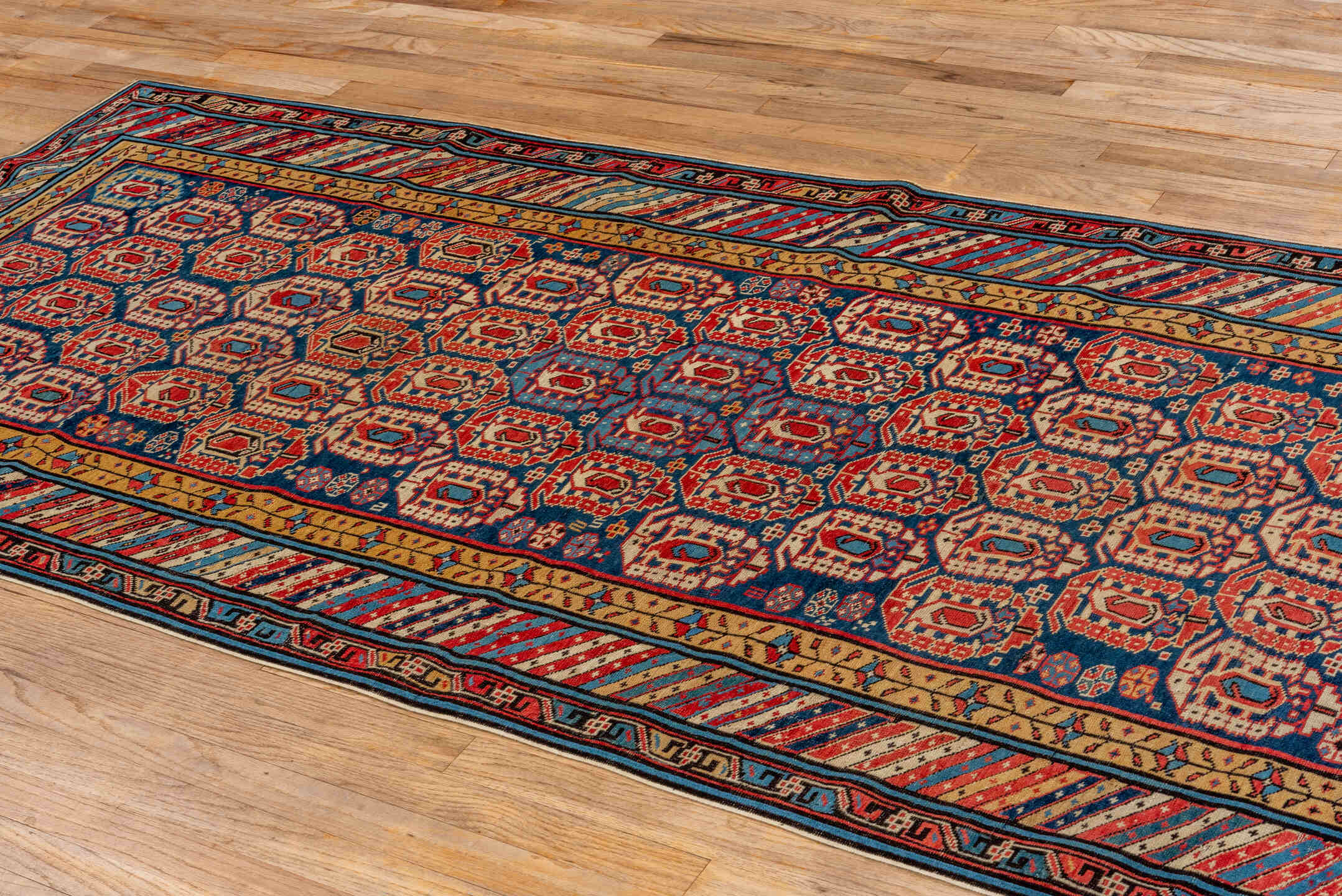 3' x 9' one-of-a-kind handmade vintage Kuba runner rug. Color palette: arapawa, blue, brown, gray, orange, pink, red
