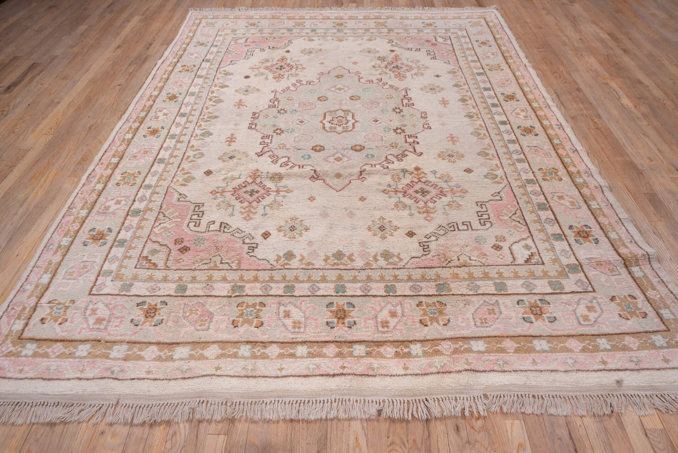 7' x 10' one-of-a-kind handmade antique Oushak large size rug. Color palette: blush, ivory, taupe, camel, sage, gold, rose