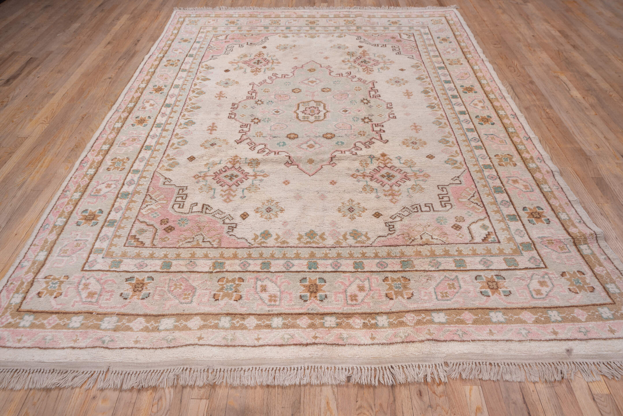 7' x 10' one-of-a-kind handmade antique Oushak large size rug. Color palette: blush, ivory, taupe, camel, sage, gold, rose